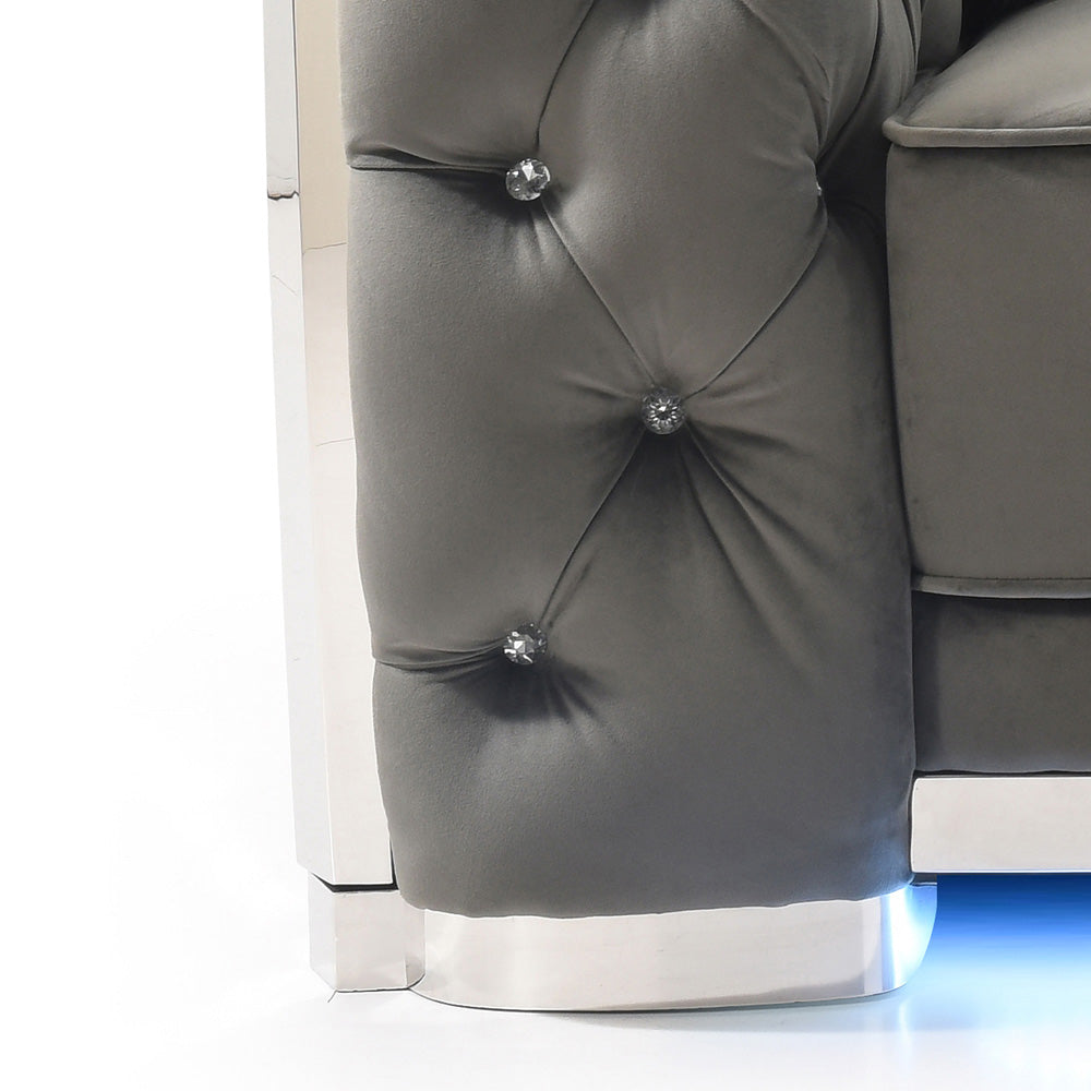 Tufted grey velvet sofa arm with crystal buttons and chrome base