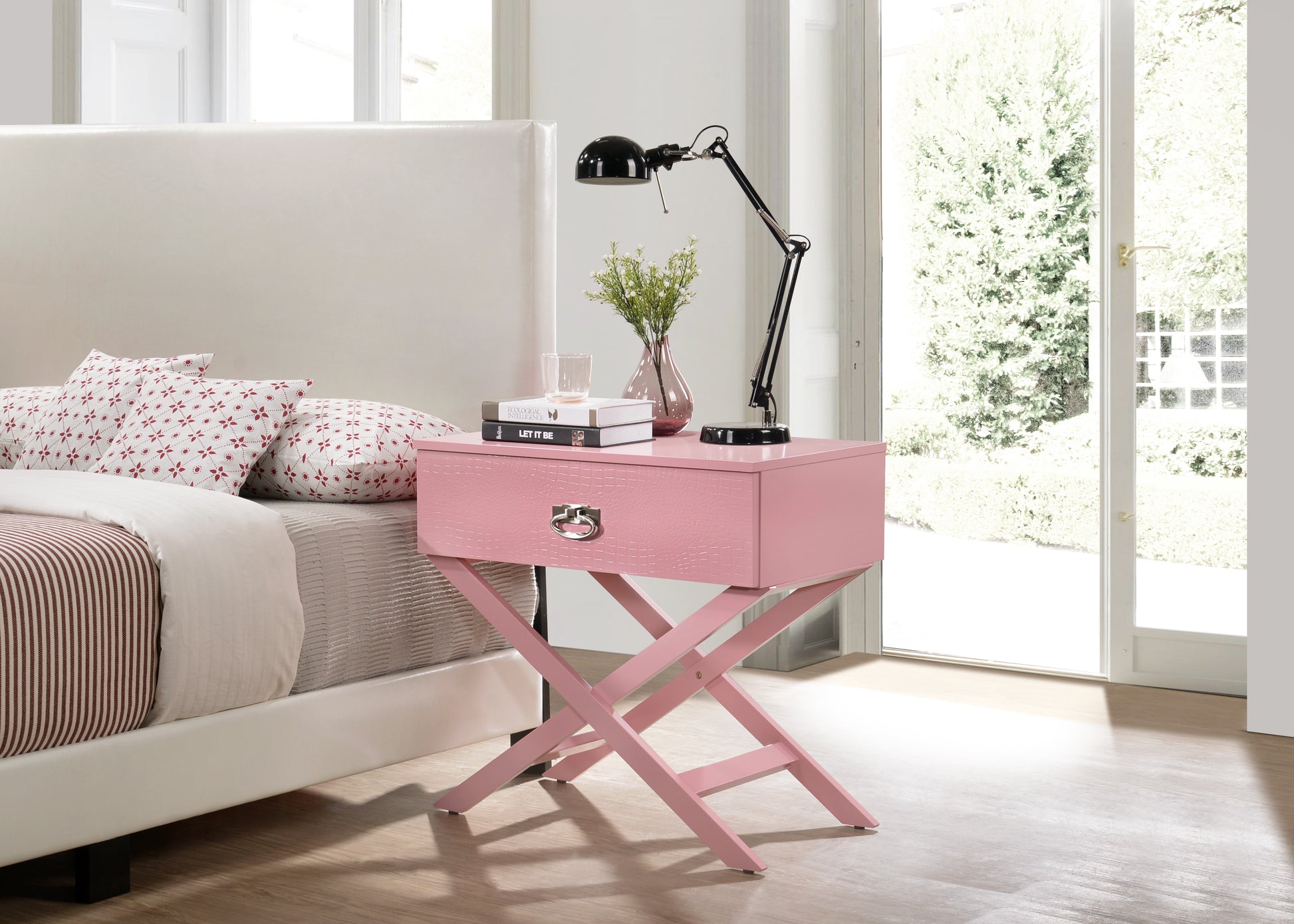 Pink textured nightstand with a silver ring pull drawer and xleg base