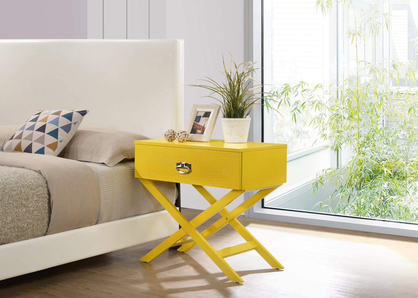 Vibrant yellow textured nightstand with a drawer and silver handle on an Xshaped base