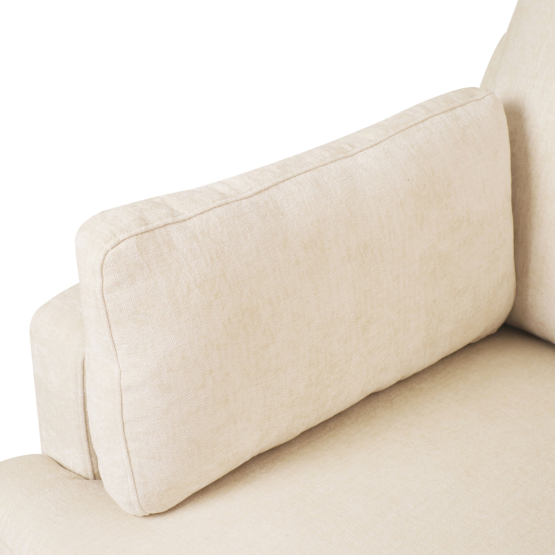 Closeup of a plush beige linen sofa armrest and cushion showing textured fabric detail
