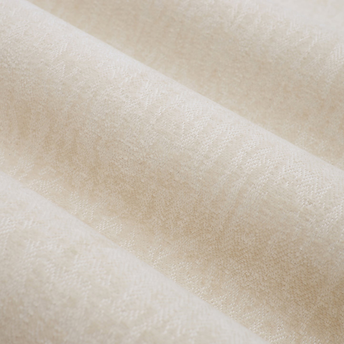 Cream chenille fabric with a subtle diamond weave pattern ideal for upholstery