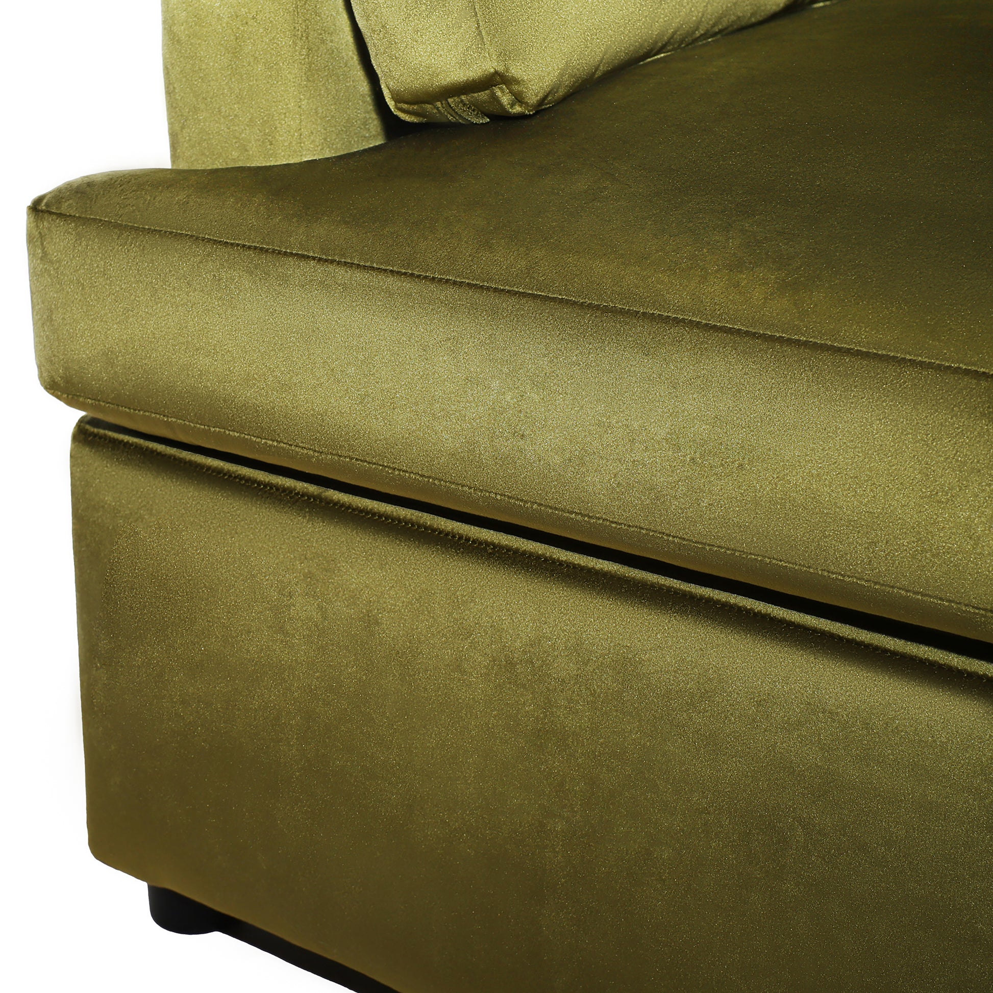 Closeup of plush olive green velvet sofa fabric with subtle shimmer