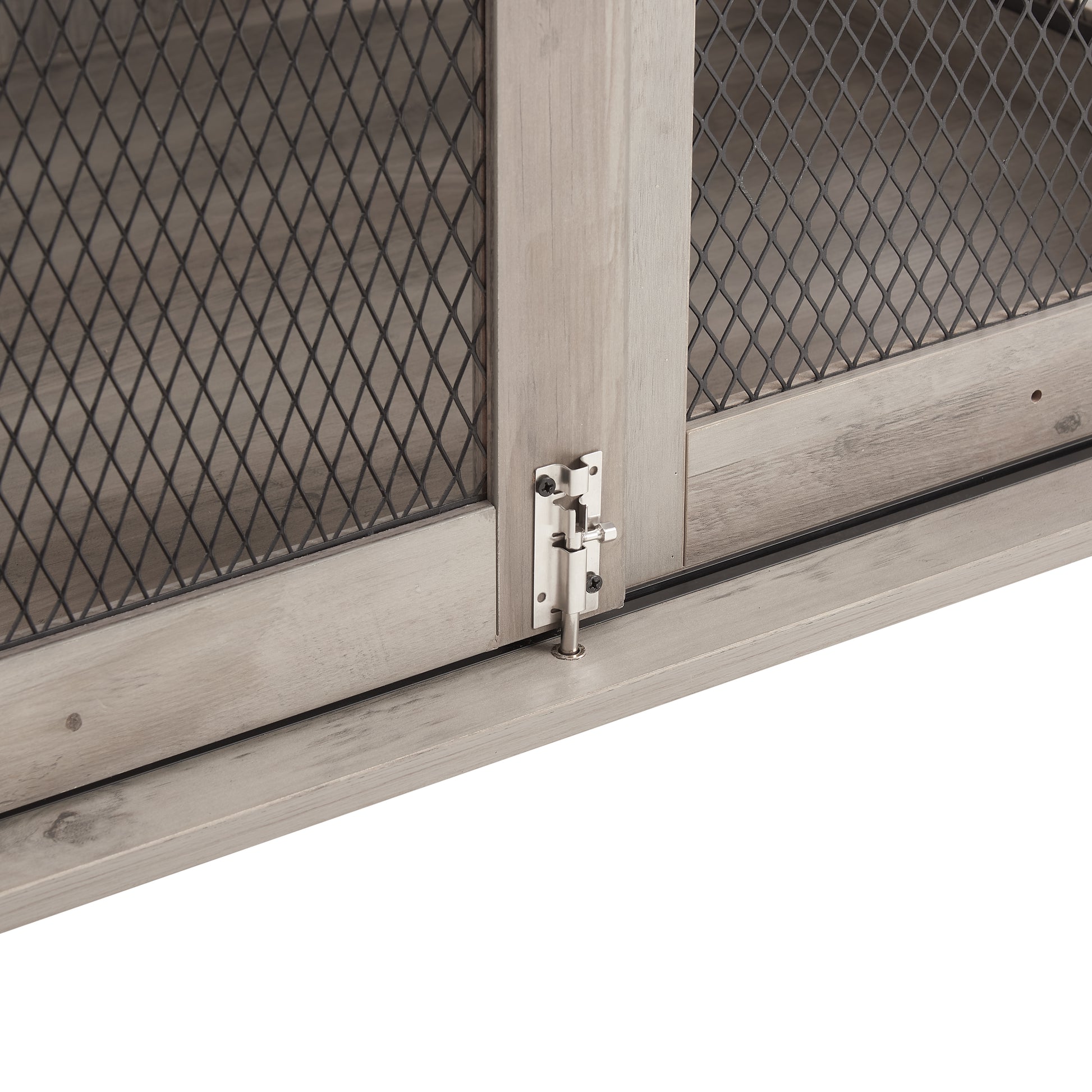 Rustic grey wood cabinet door with metal mesh inlay and bolt latch