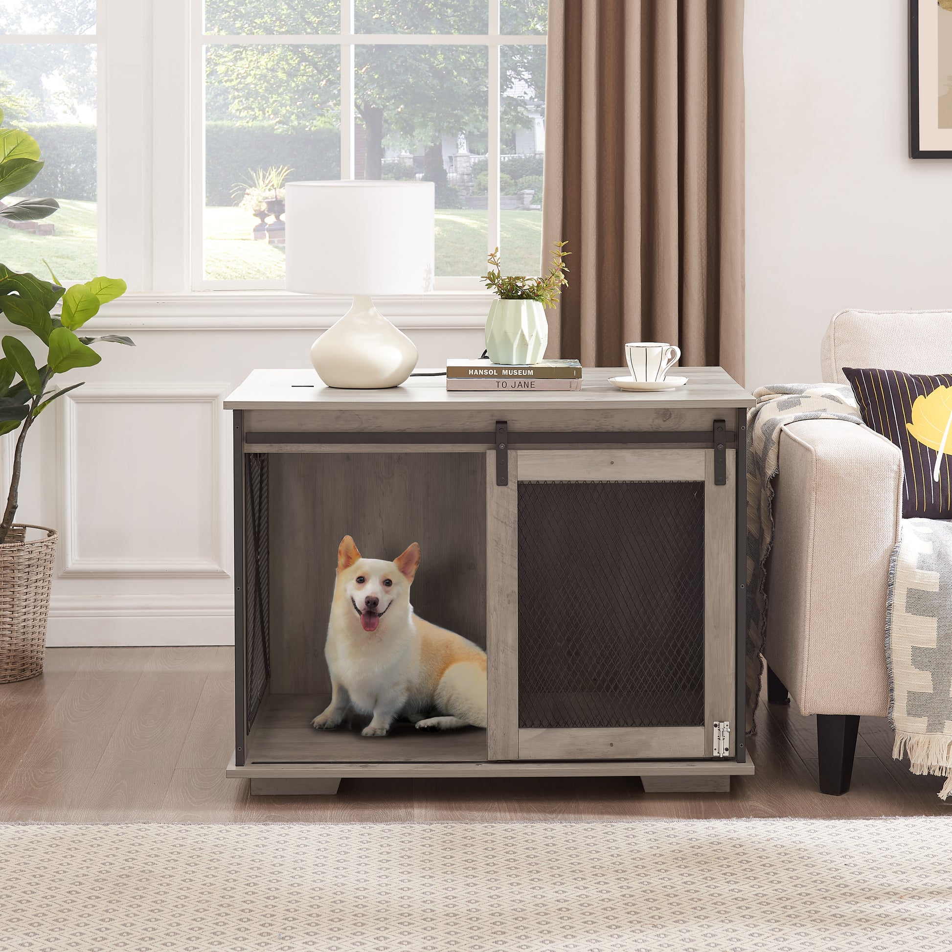 Rustic grey wooden dog crate with sliding barn door features wire mesh panel A happy white dog sits inside