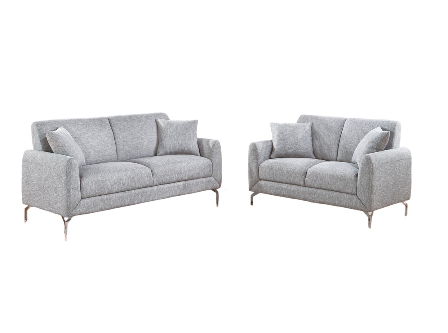 Modern light gray fabric threeseater sofa with chrome legs and accent pillows