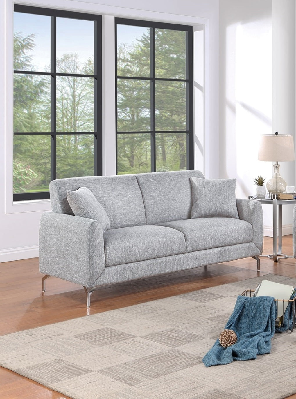 Light gray upholstered sofa with sleek silver legs perfect for modern living rooms