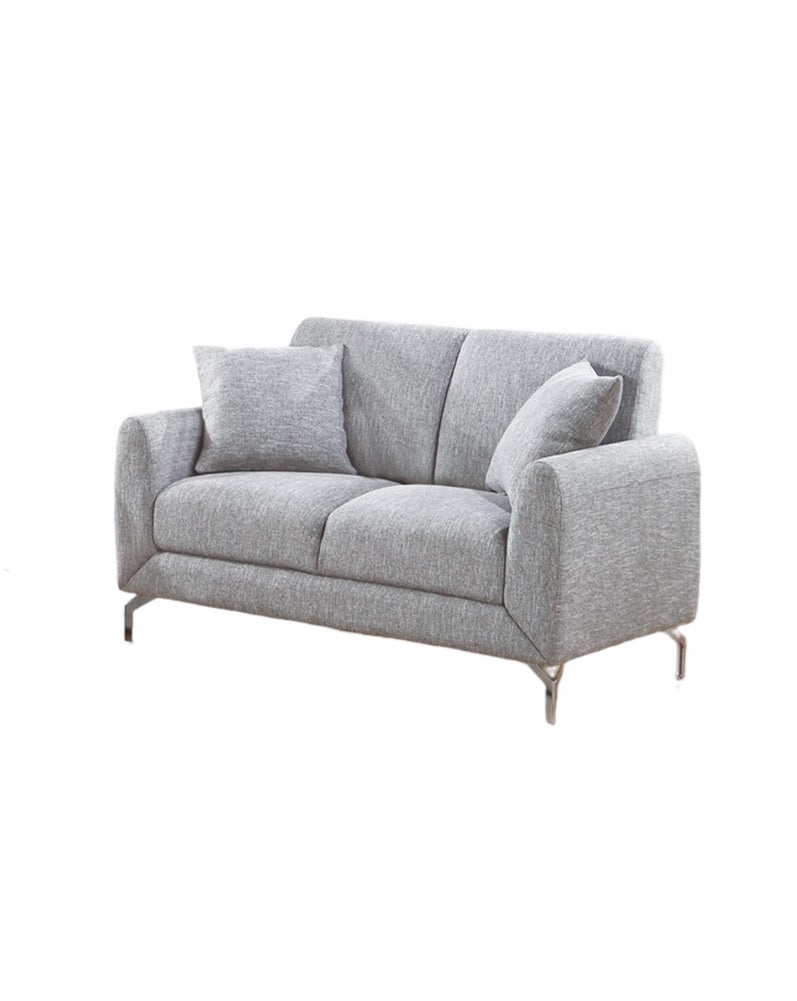 Modern grey fabric sofa with two throw pillows and sleek metal legs