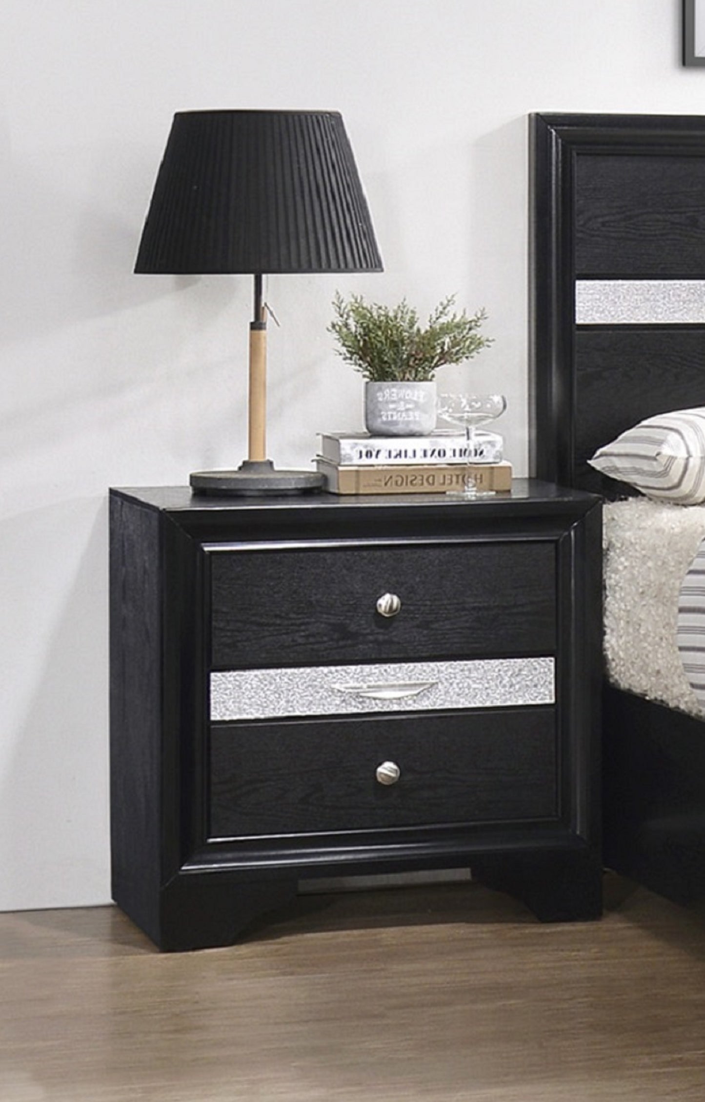 Black wooden nightstand with two drawers featuring silver accents and brushed nickel knobs