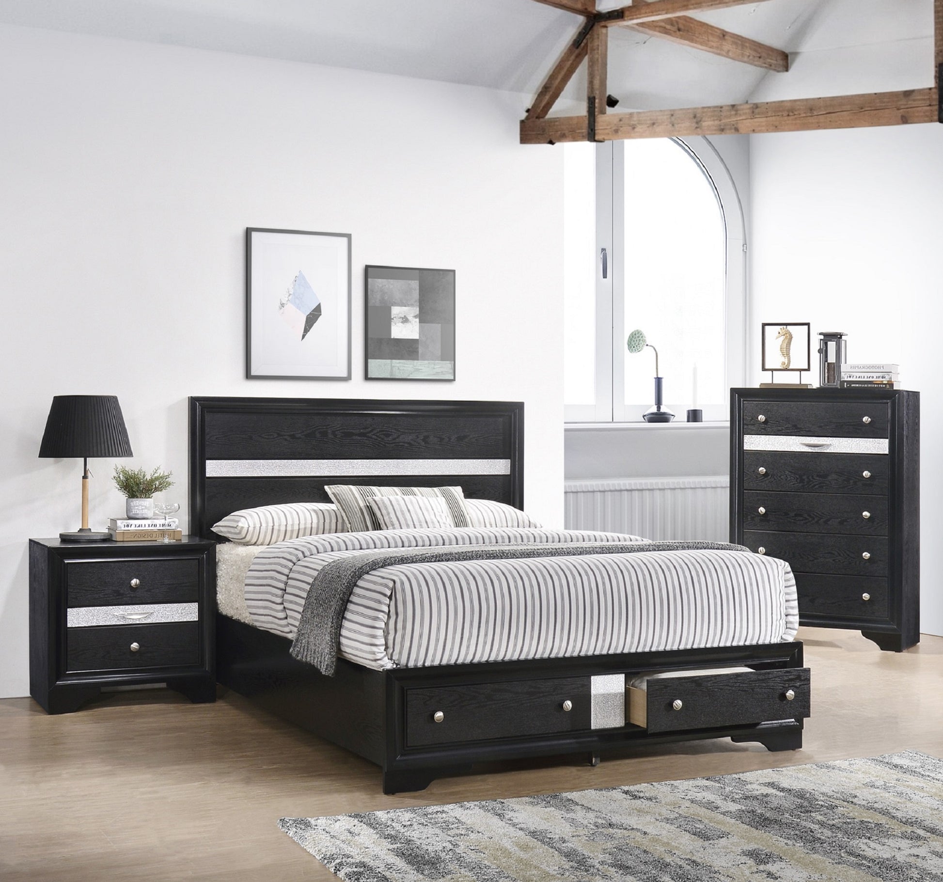 Black wood platform bed with storage drawers and silver trim detailing