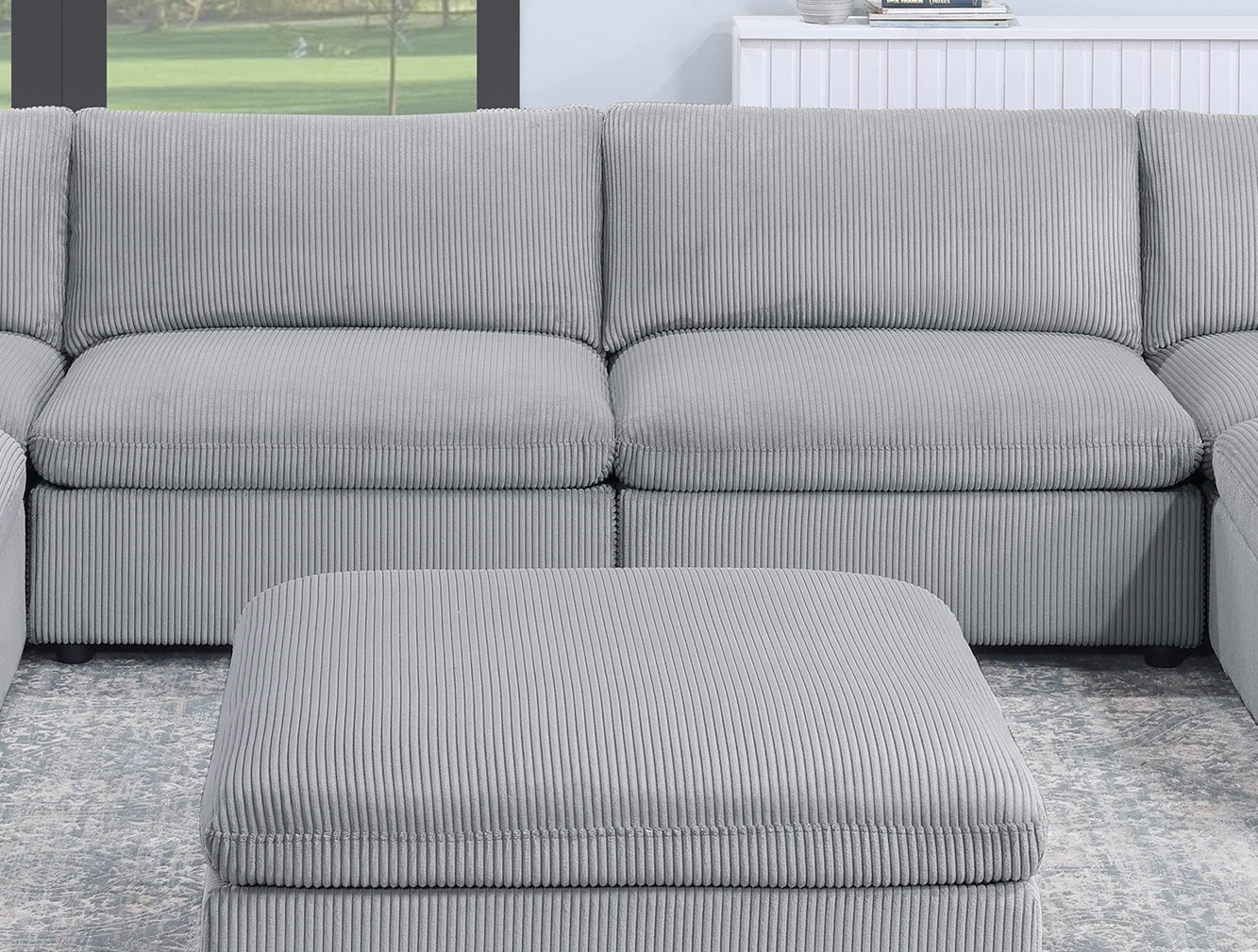 Sectional corduroy sofa in light grey with matching ottoman for living room comfort