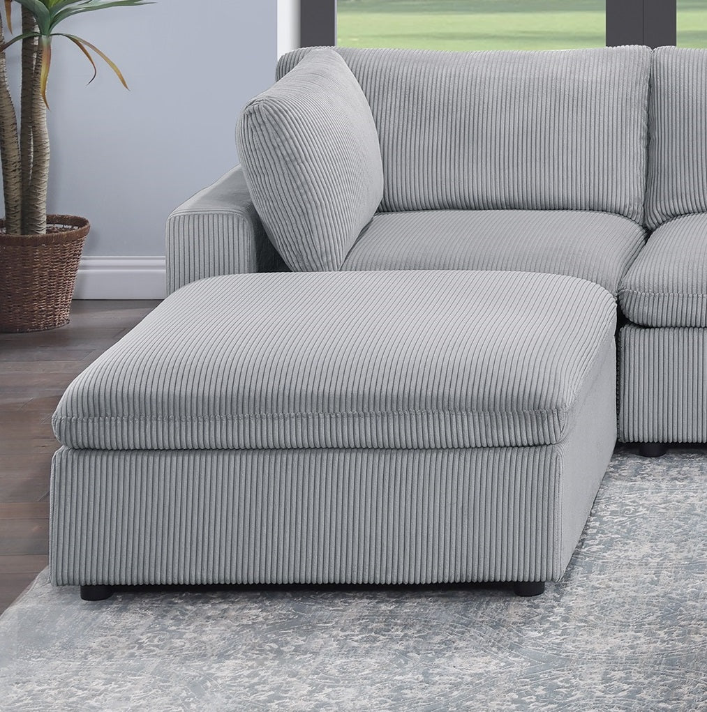 Gray corduroy storage ottoman with plush top complements modular sofa