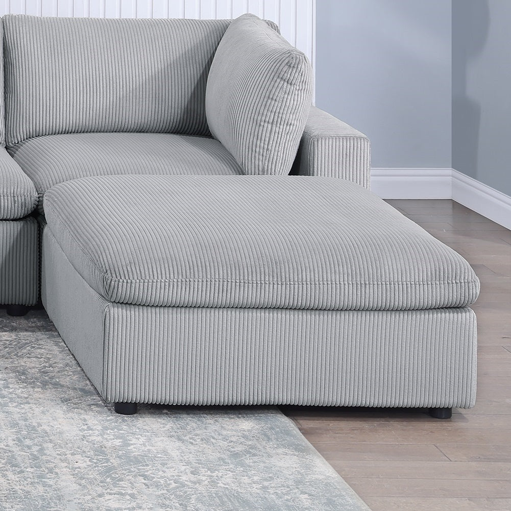 Gray corduroy modular sofa ottoman with plush cushioning and matching toss pillow