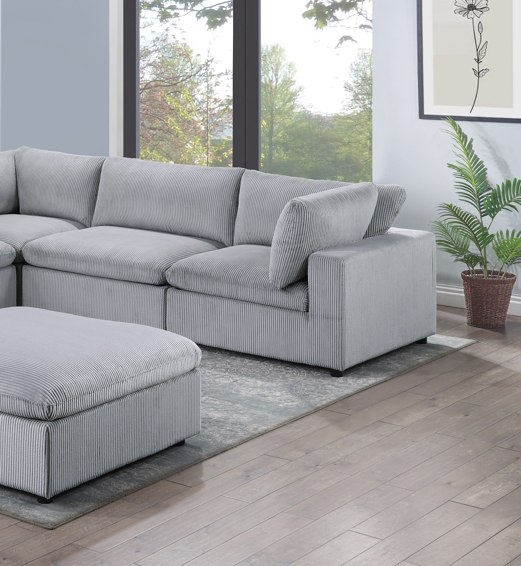 Plush grey corduroy sectional sofa with matching ottoman for ultimate comfort