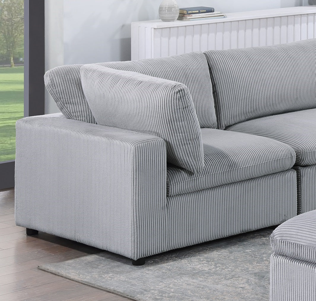 Gray corduroy sectional sofa with plush cushions and a modern design perfect for living rooms