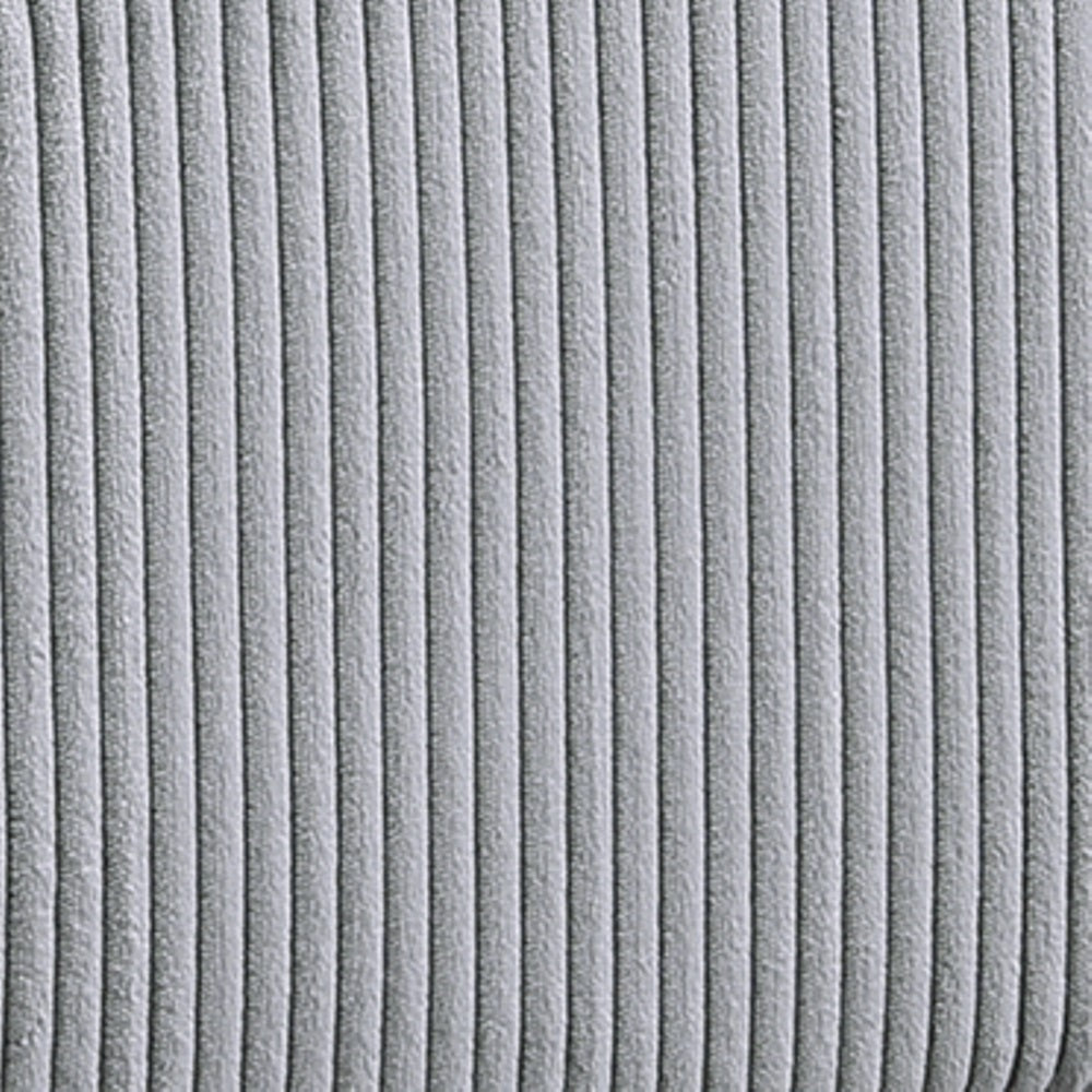 Closeup of light gray corduroy fabric with vertical ridges ideal for upholstery