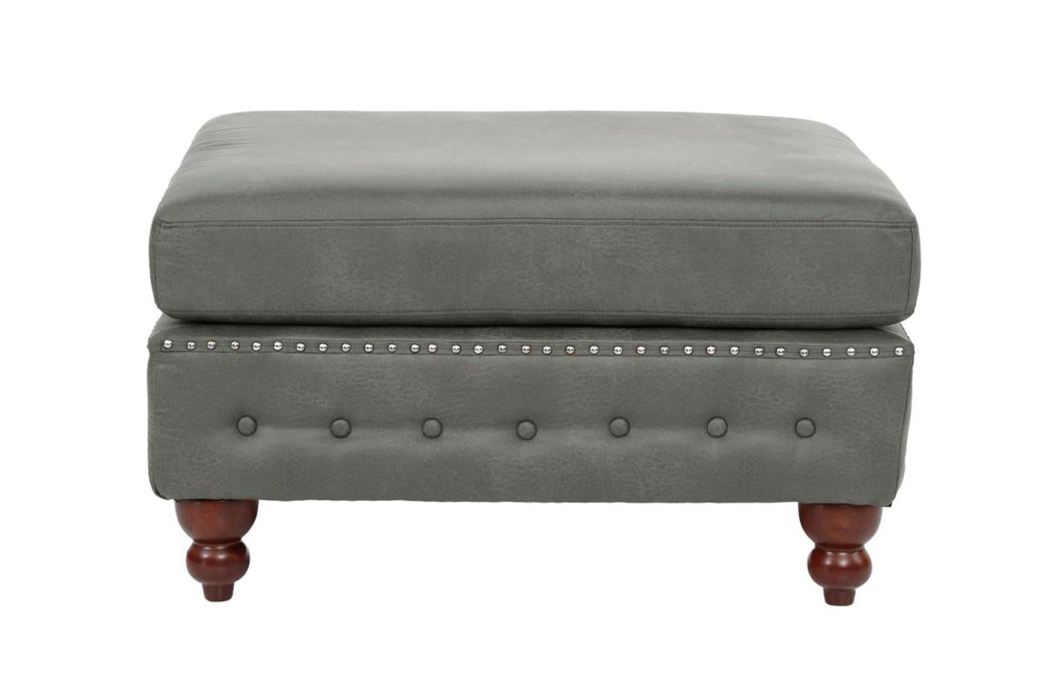 Gray faux leather ottoman with tufted details and decorative nailhead trim