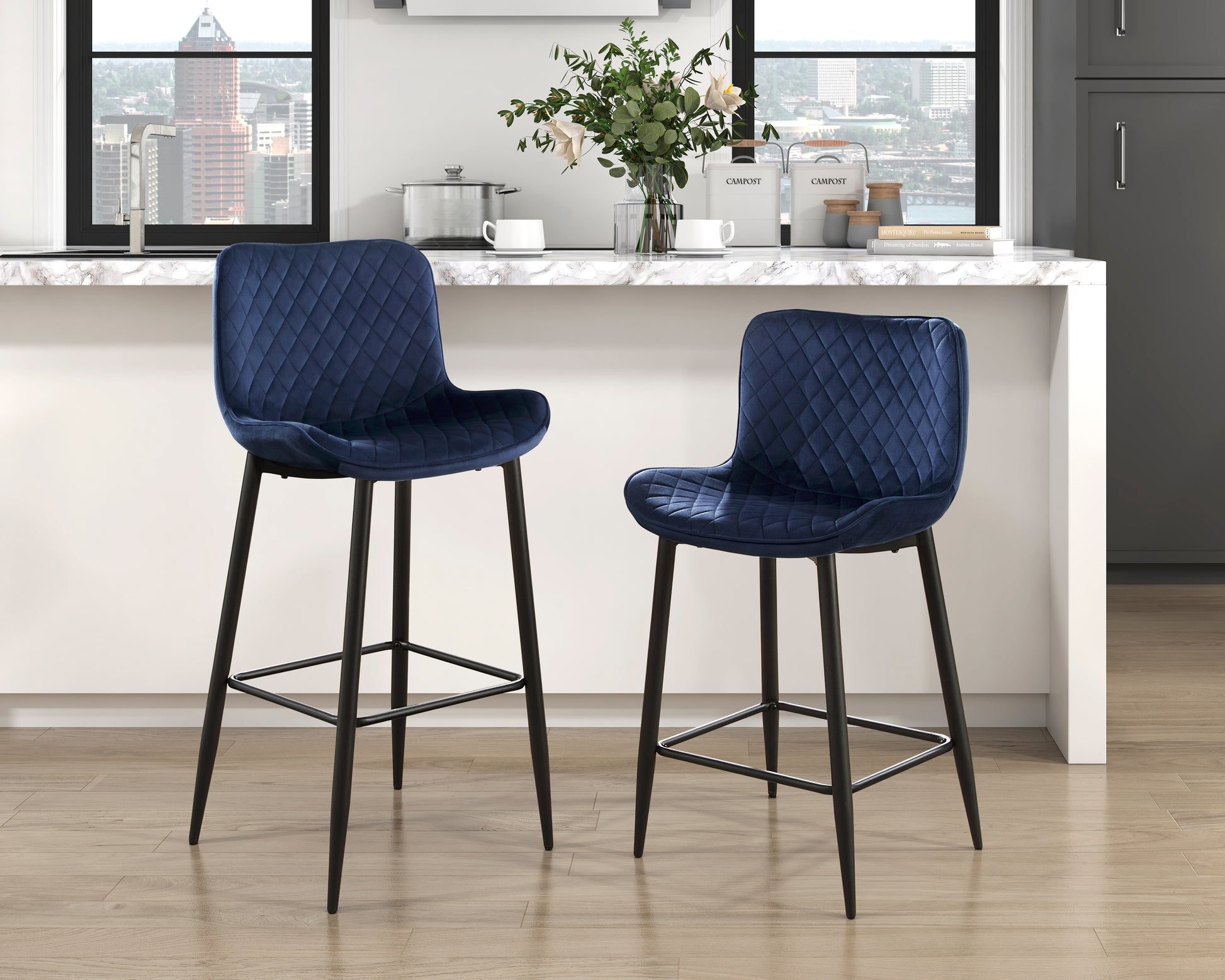 Quilted navy blue velvet bar stool with sleek black metal legs