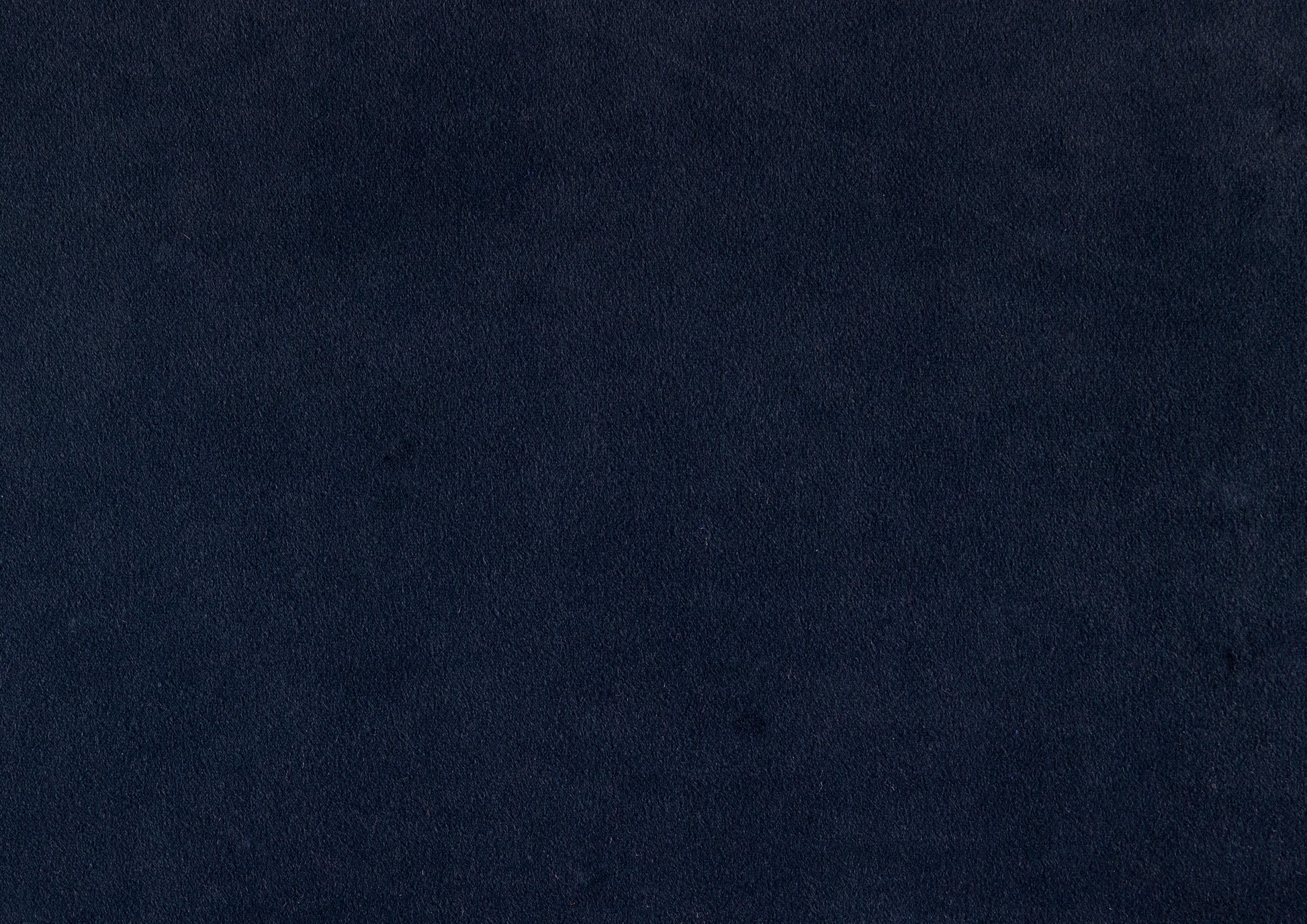 Closeup of textured navy blue fabric perfect for upholstery