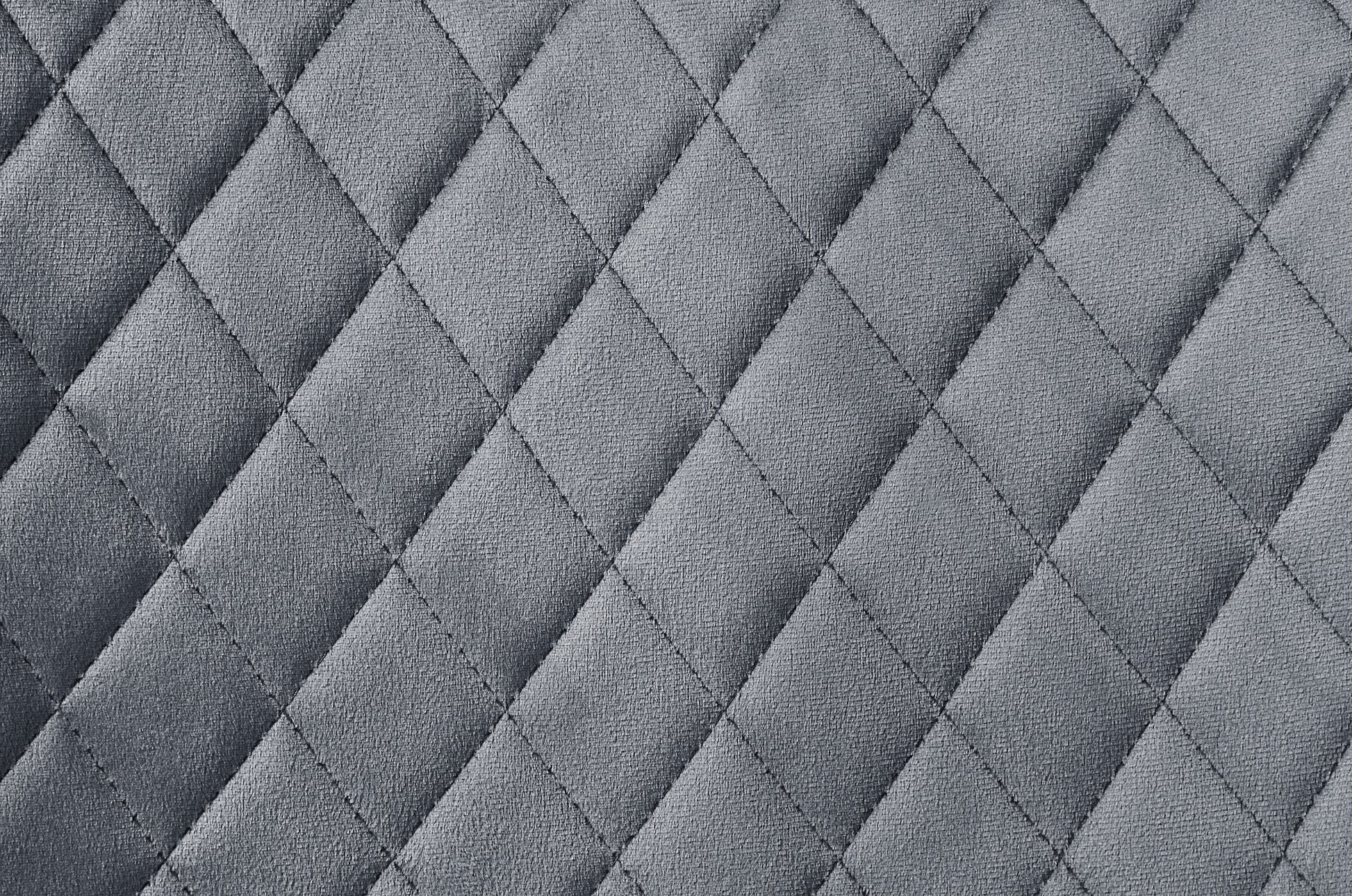Closeup of gray quilted fabric texture with diamond pattern stitching