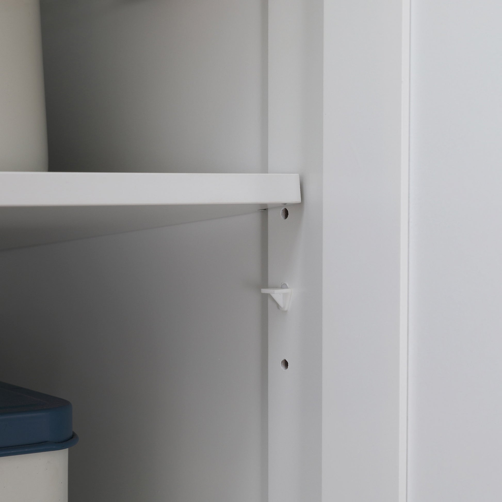 White adjustable shelf clip for cabinet organization