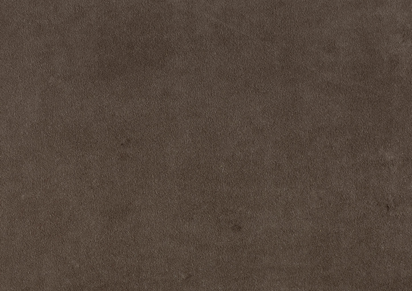 Closeup texture of dark brown suede fabric ideal for upholstery