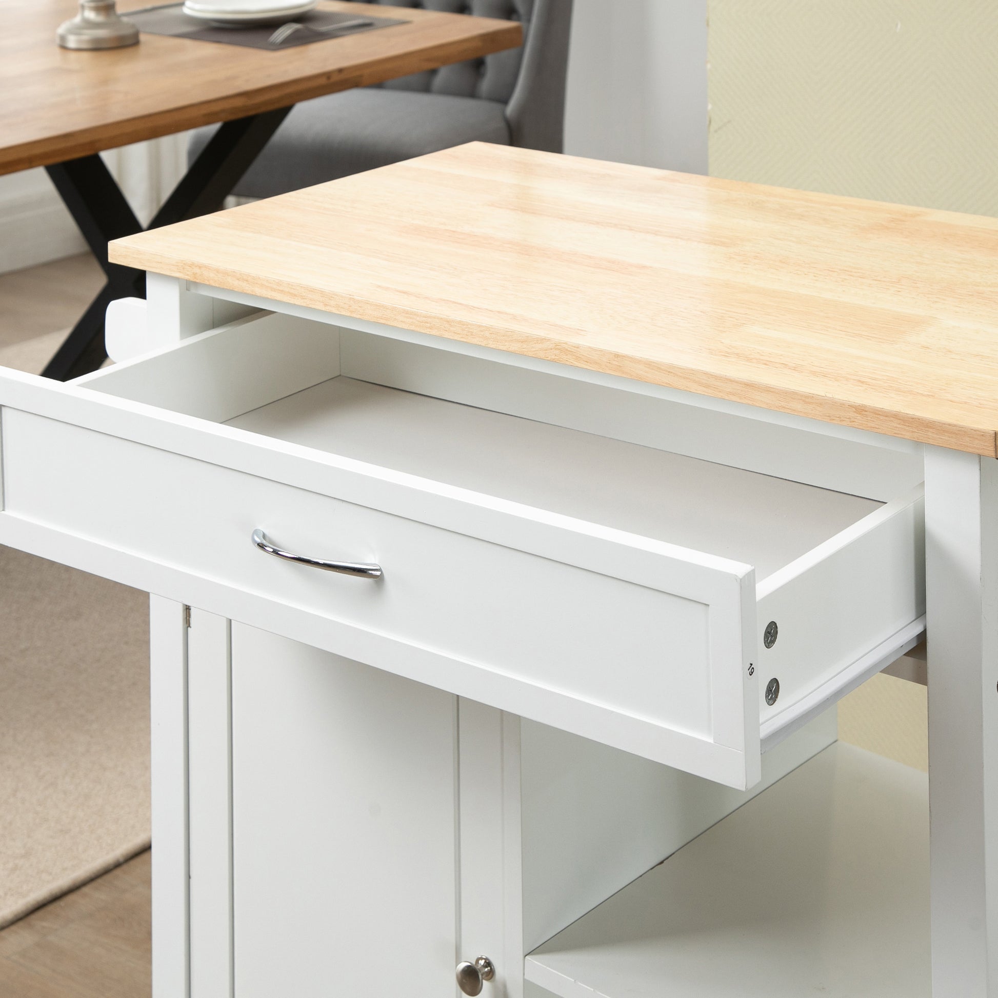 White kitchen cart with open drawer and silver handle