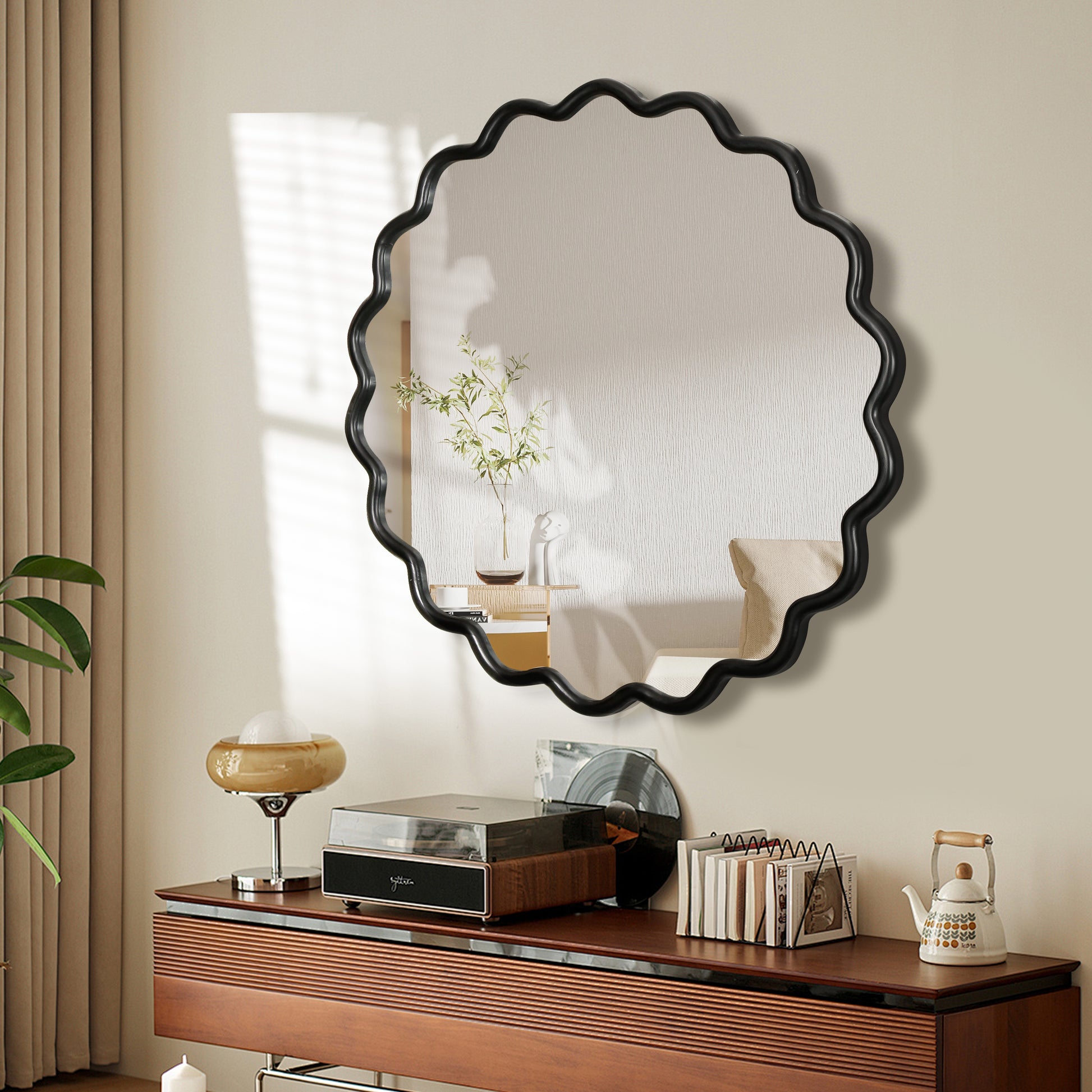 Scalloped black framed decorative wall mirror with vintage turntable