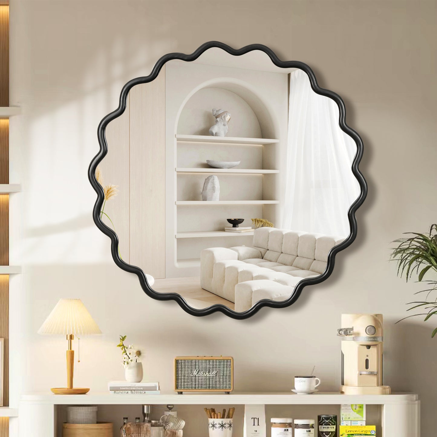 Black scalloped edge mirror reflecting a modern living space with a white sofa