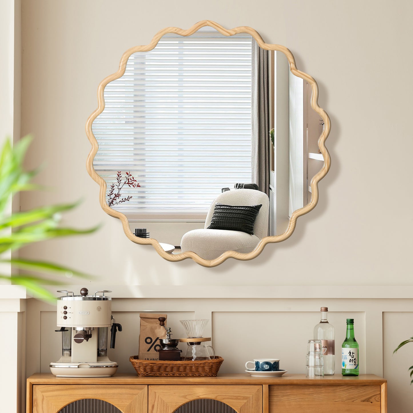 Scalloped wooden frame mirror reflecting a chair with striped blinds
