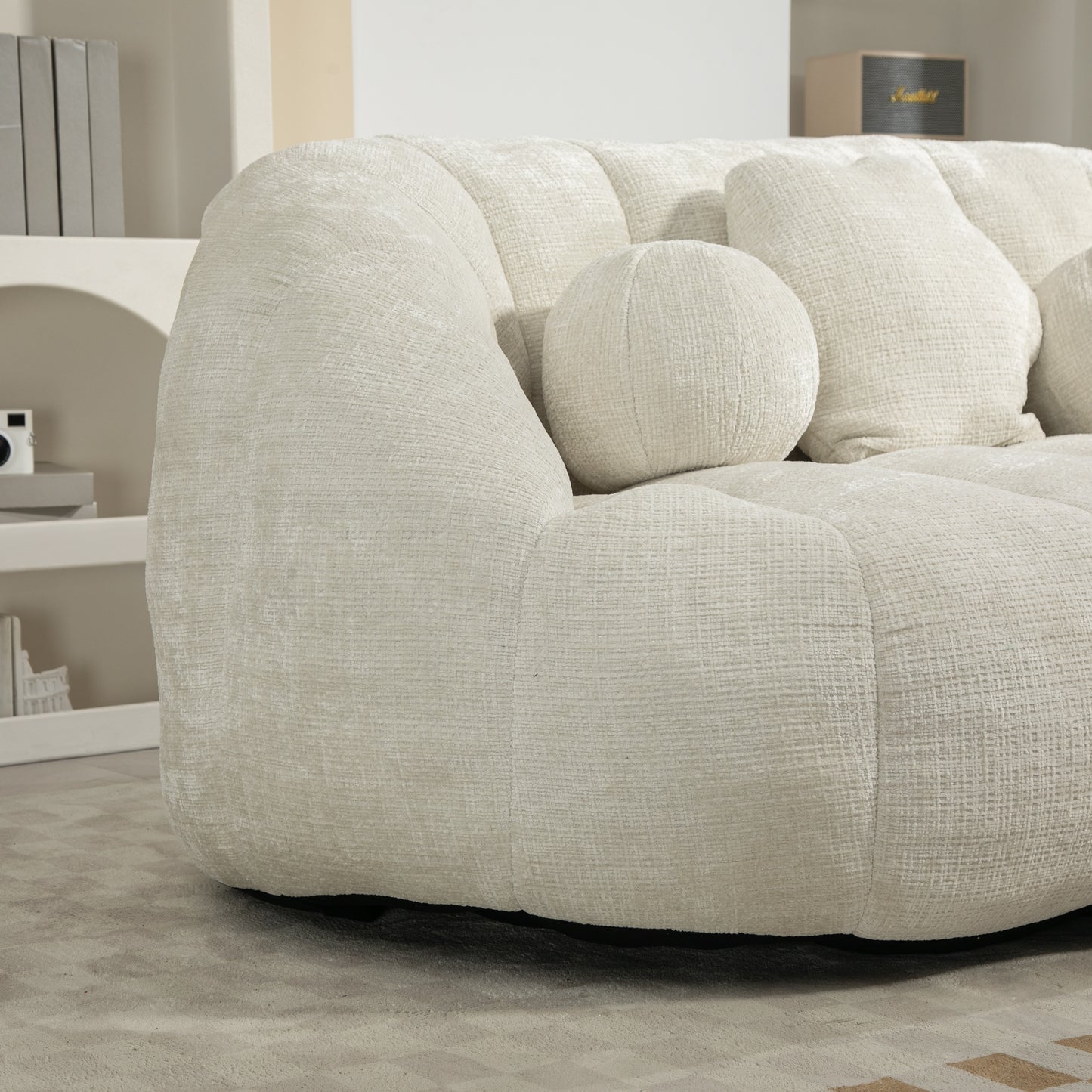 Cream boucle tufted sofa with round accent pillow for living room comfort