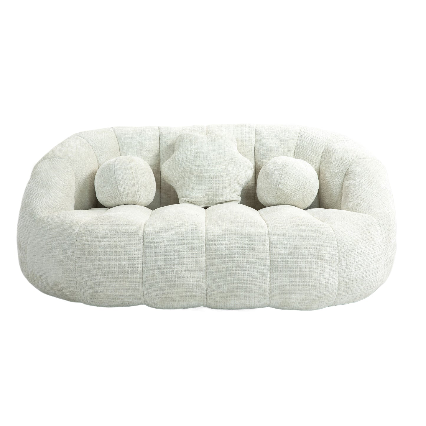 Plush cream textured fabric sofa with rounded arms and three decorative pillows