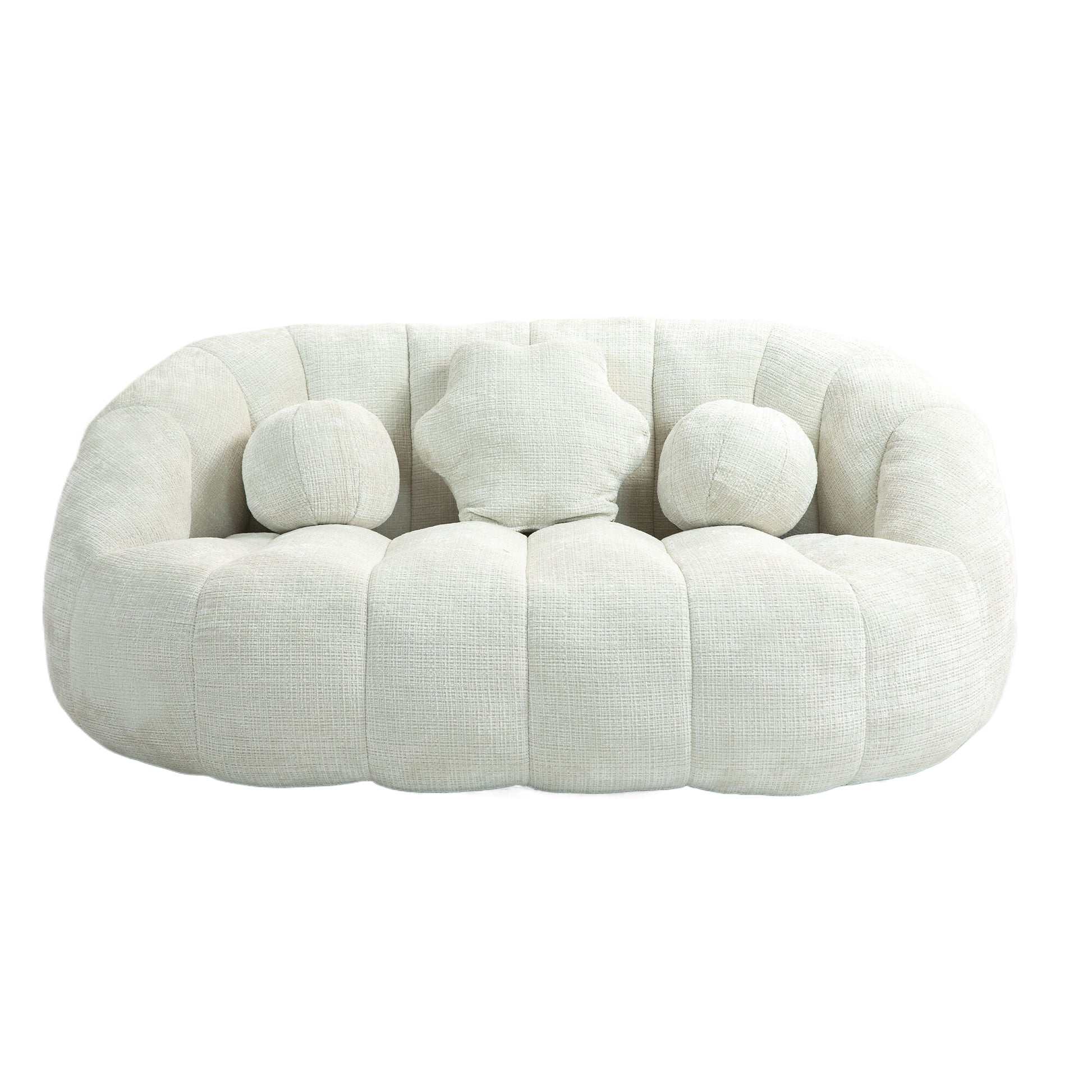 Plush cream textured fabric sofa with rounded arms and three decorative pillows