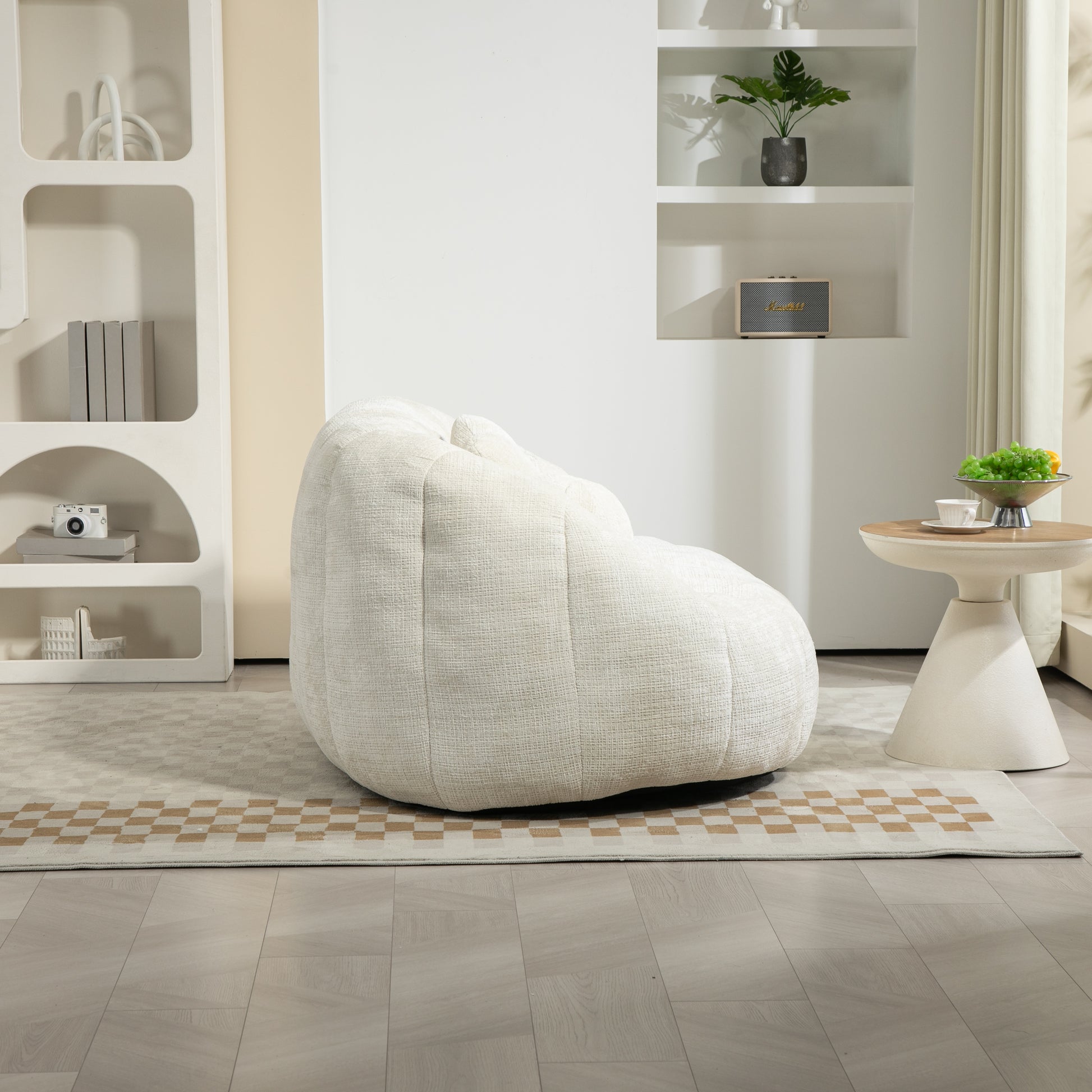Plush ivory boucl bean bag chair with channel tufting perfect for a modern living room