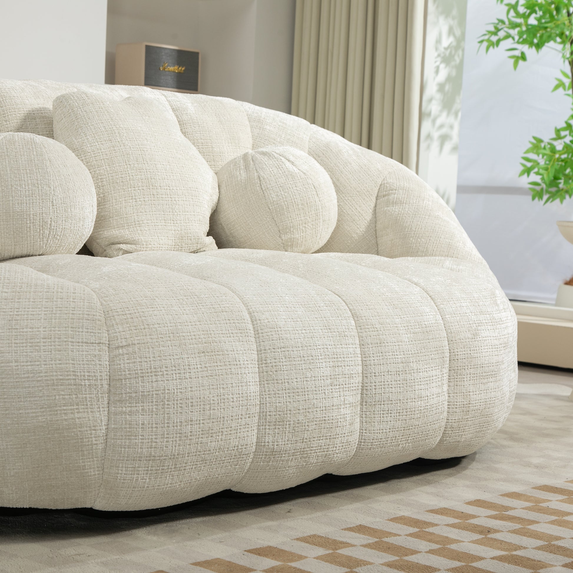 Textured cream boucle sofa with plush rounded cushions modern living room accent