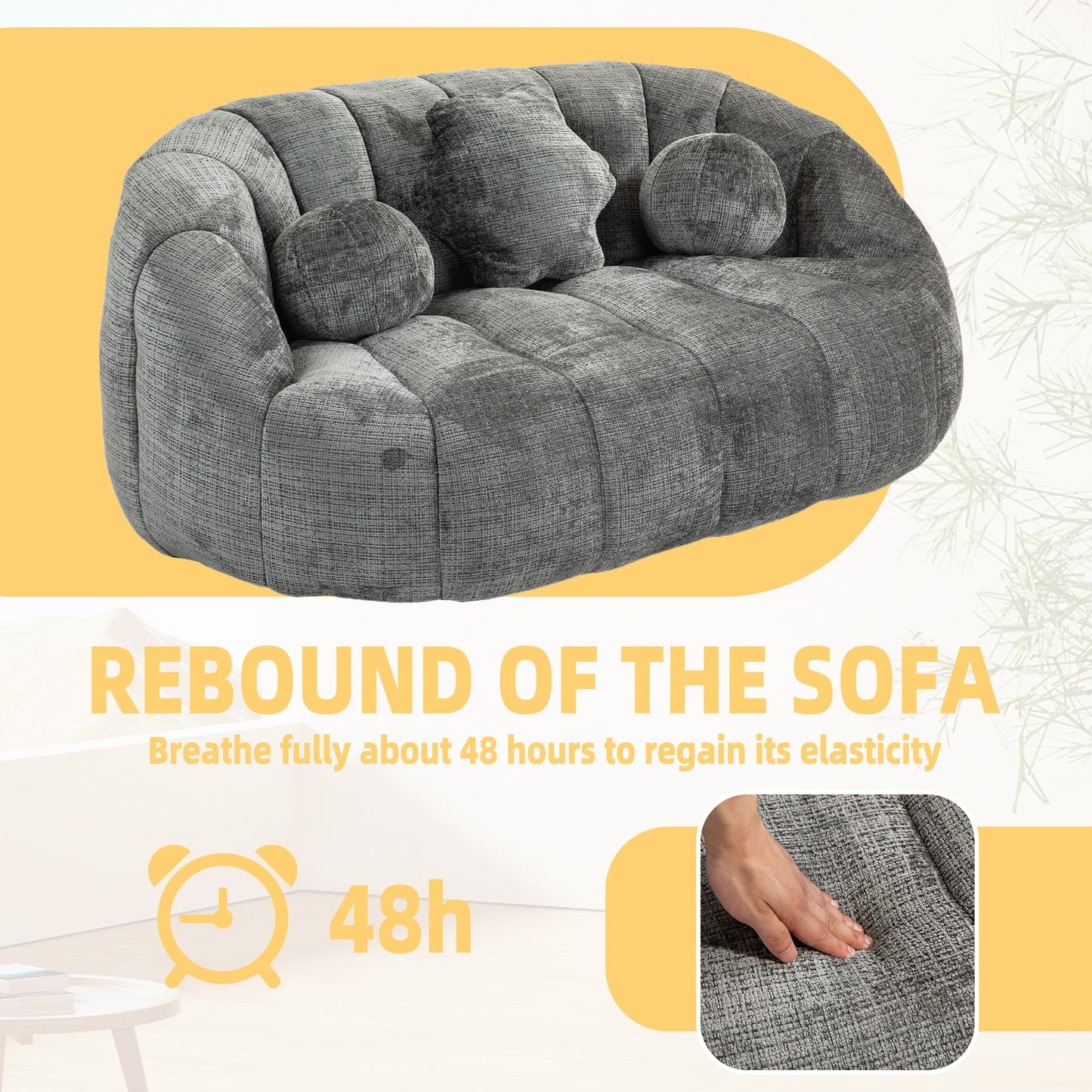 Plush grey sofa with channeled upholstery and round accent pillows for a modern living room