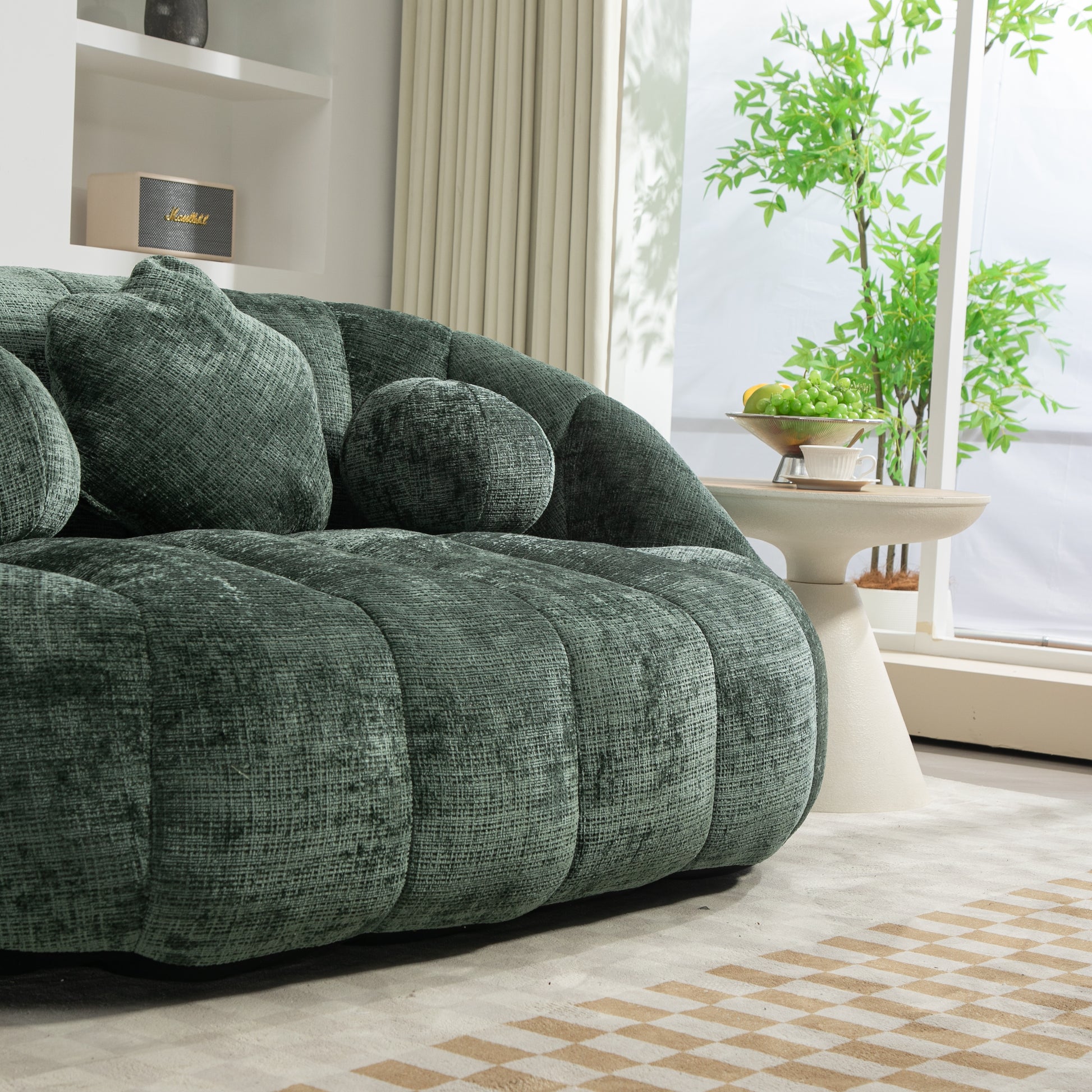 Plush emerald green velvet sofa with channel tufting and plush pillows for luxurious comfort