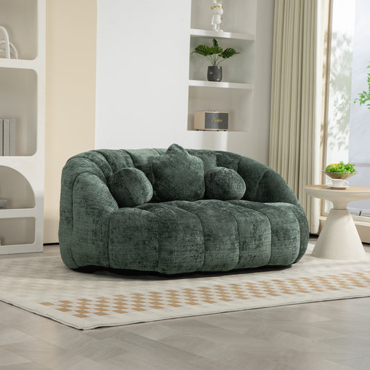 Plush emerald green velvet loveseat with channel tufting and matching throw pillows