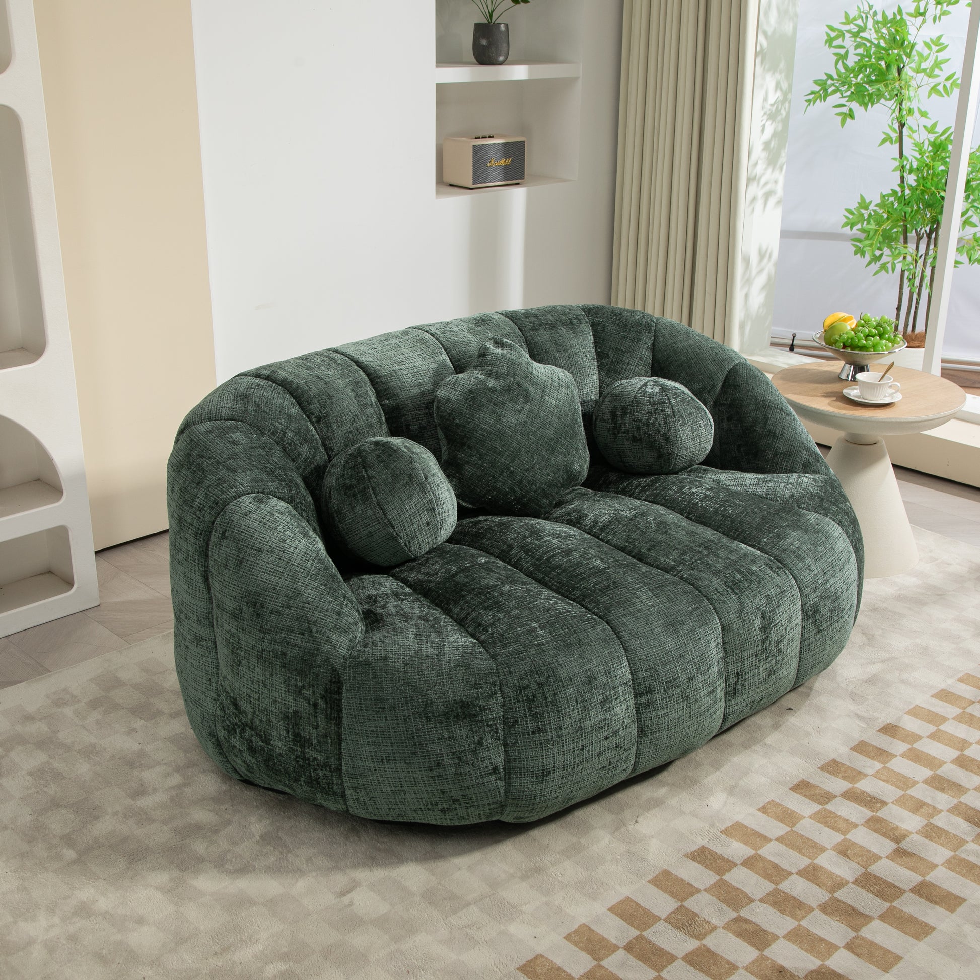 Plush emerald green boucle loveseat with channel tufting and three accent pillows perfect for a modern living room