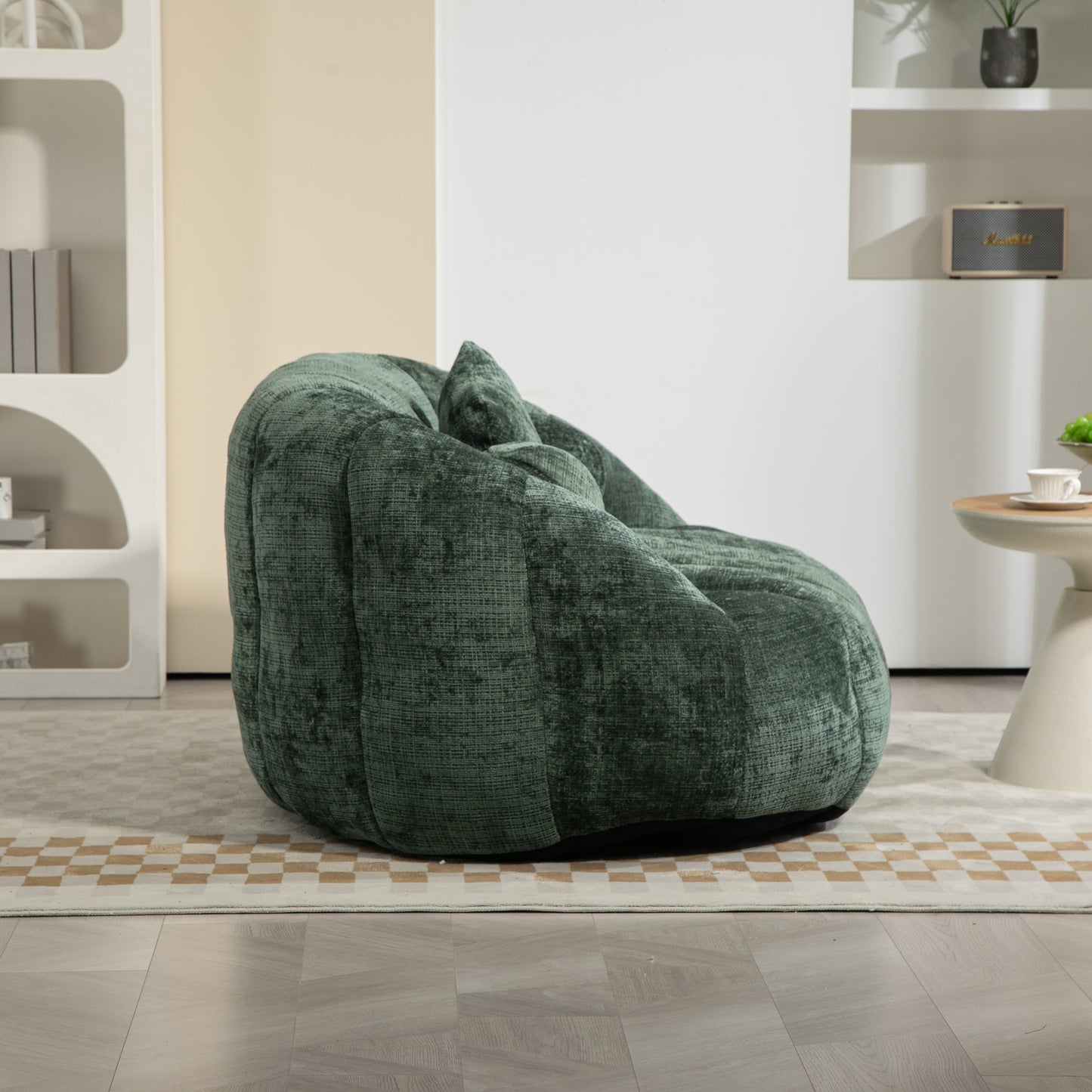 Plush green velvet bean bag chair with integrated pillow for comfortable lounging