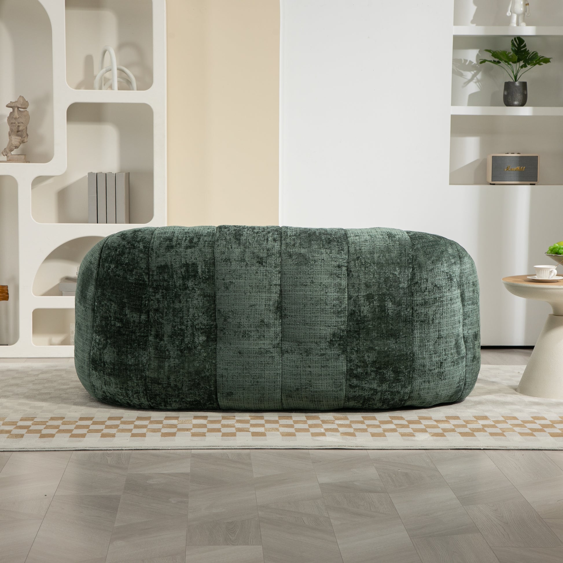 Dark green velvet ottoman with channeled stitching perfect for living room seating