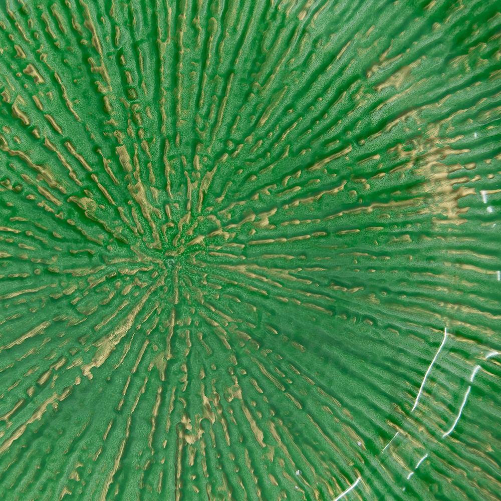 Green textured ceramic plate with gold accents radiating from center