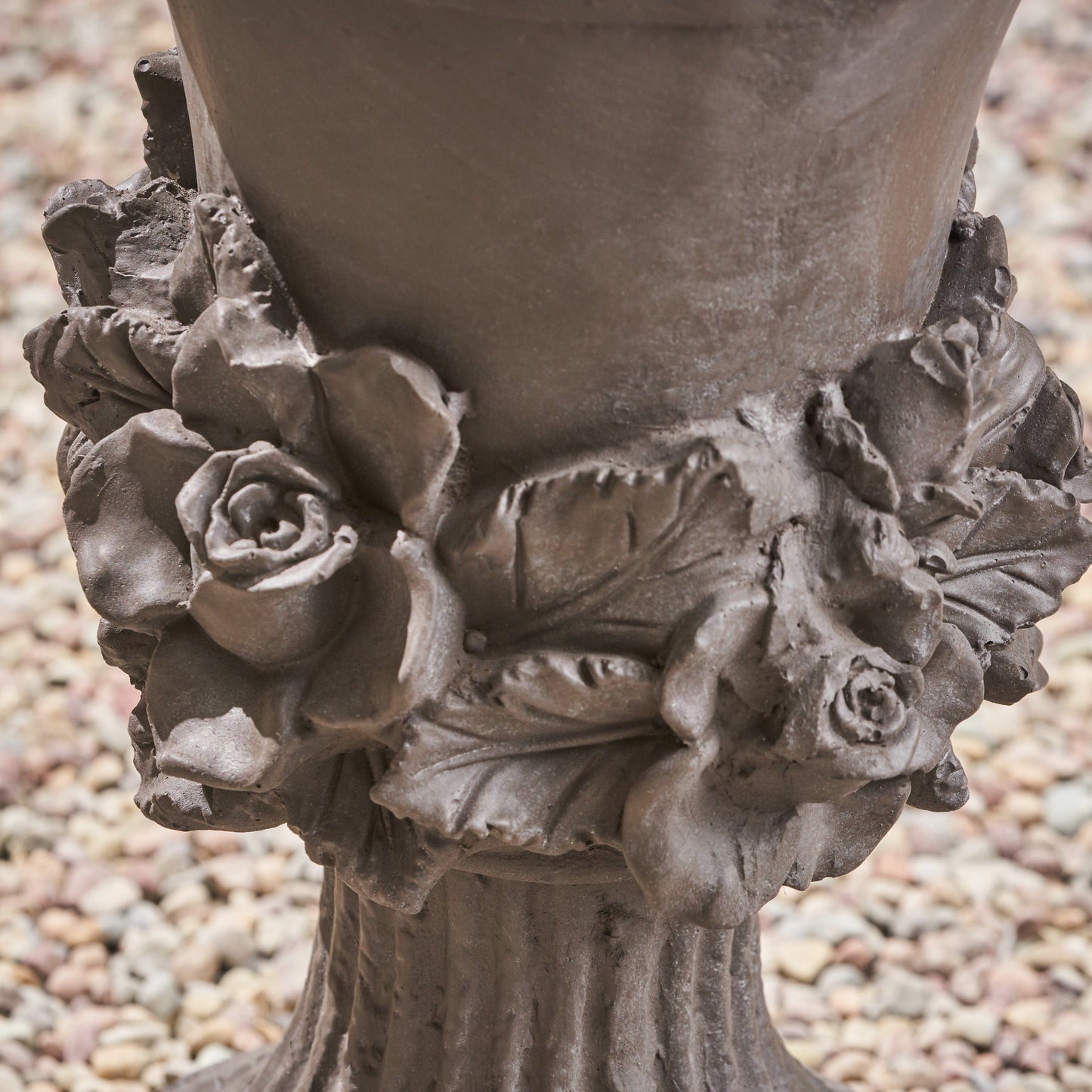 Brown garden urn with detailed rose and leaf embellishments
