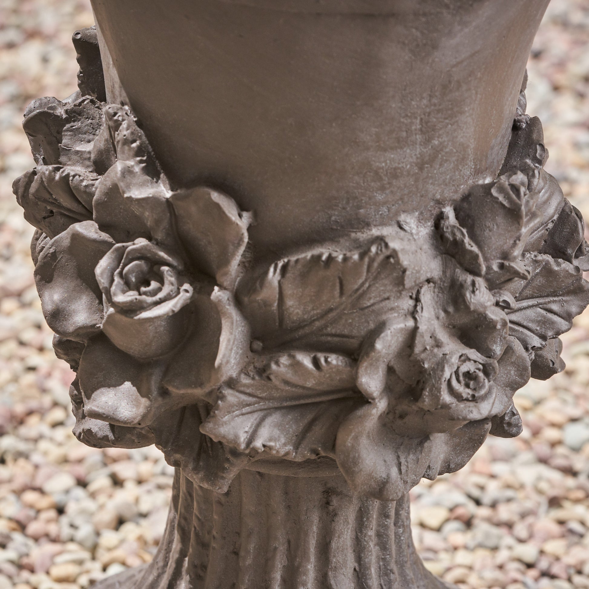 Brown garden urn with detailed rose and leaf embellishments