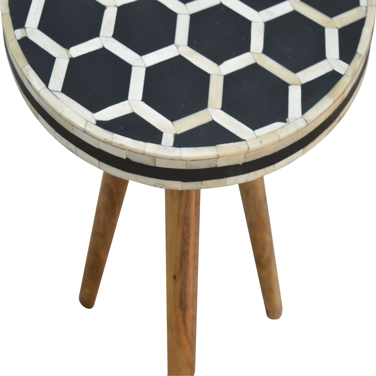 Round side table with black and bone inlay hexagon pattern and wooden legs