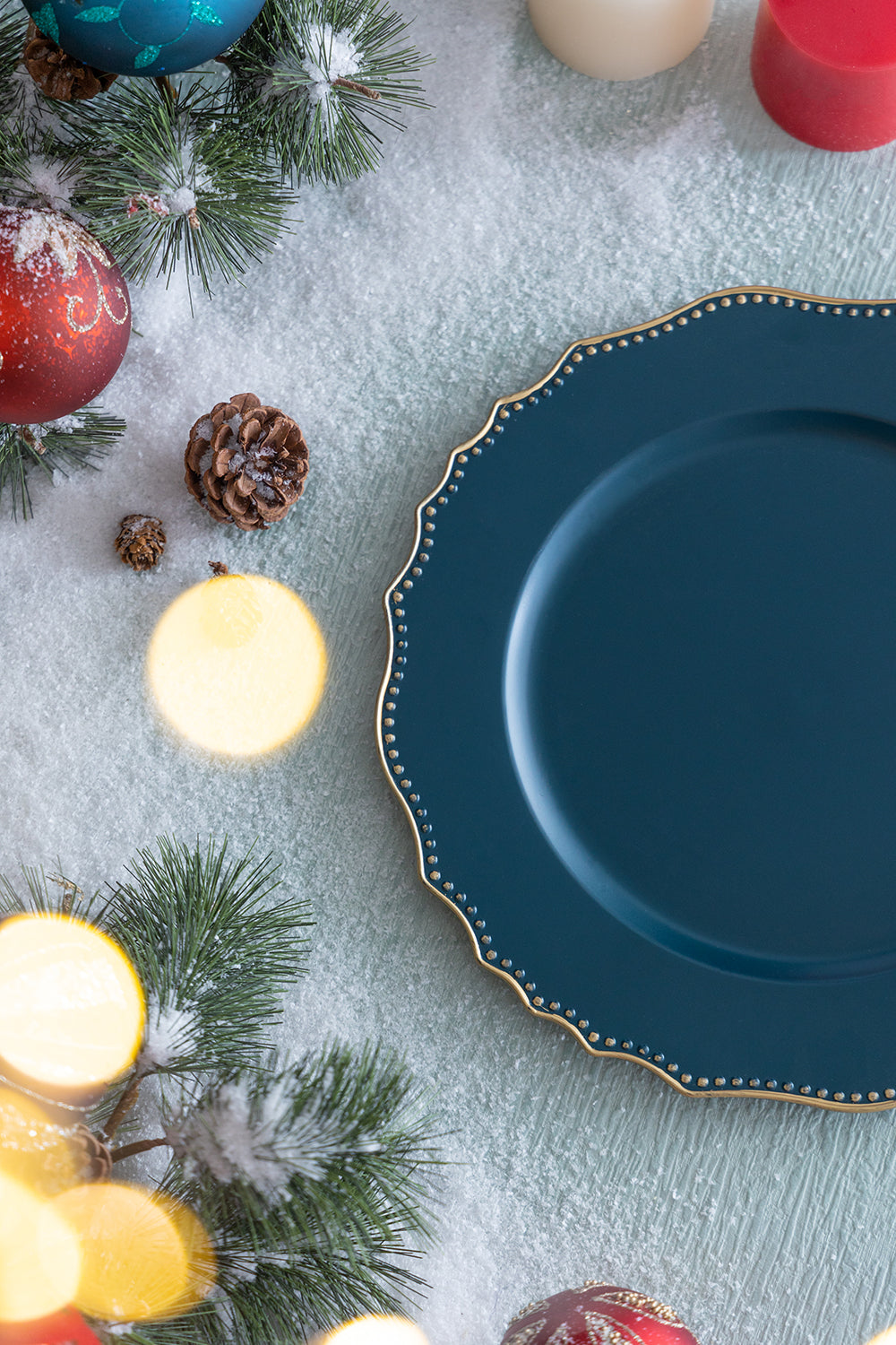 Deep teal charger plate with ornate gold beaded rim perfect for holiday tablescapes