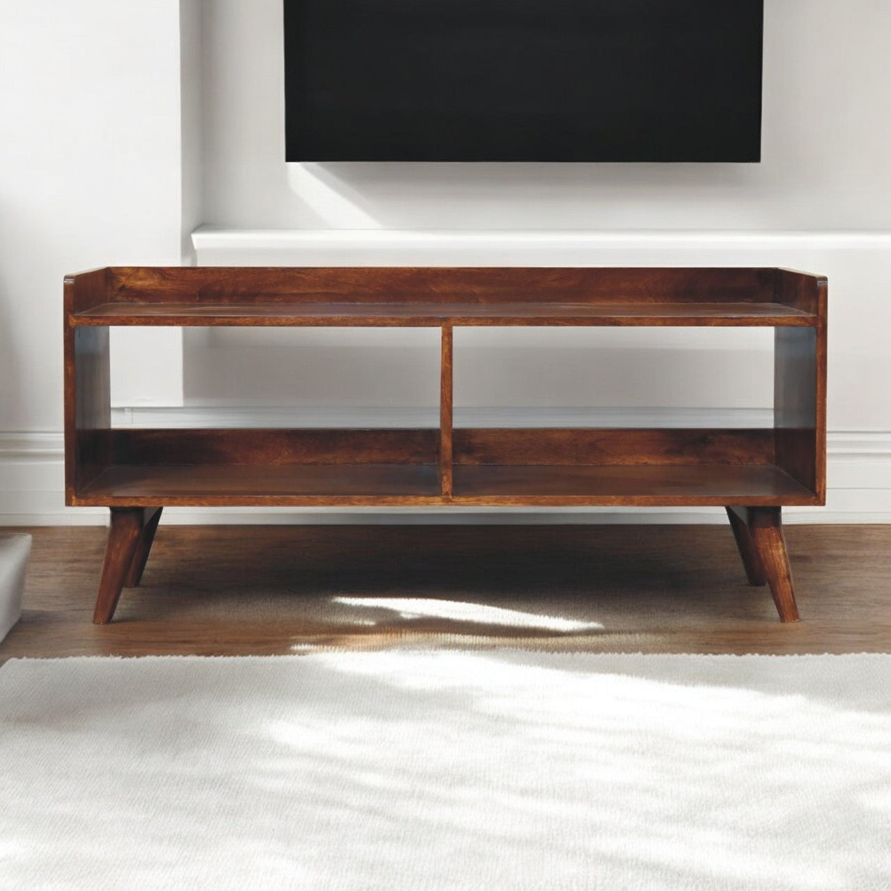 Midcentury modern wooden TV stand with two shelves and tapered legs