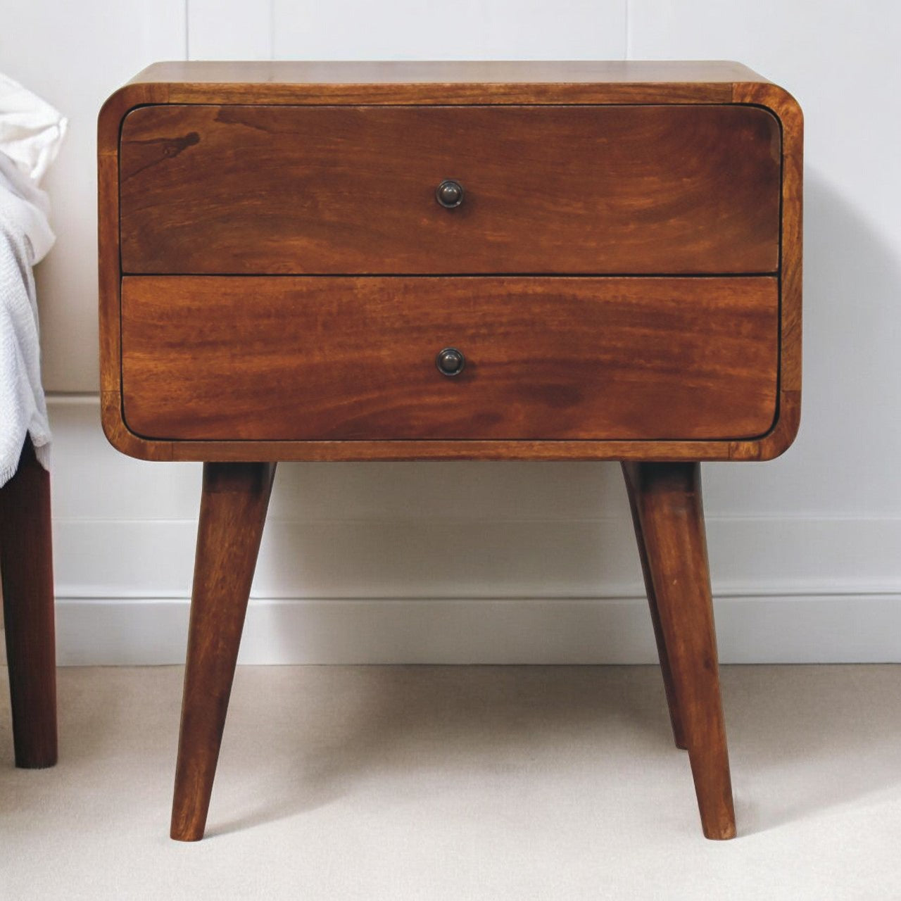 Midcentury modern walnut nightstand with two drawers and tapered legs
