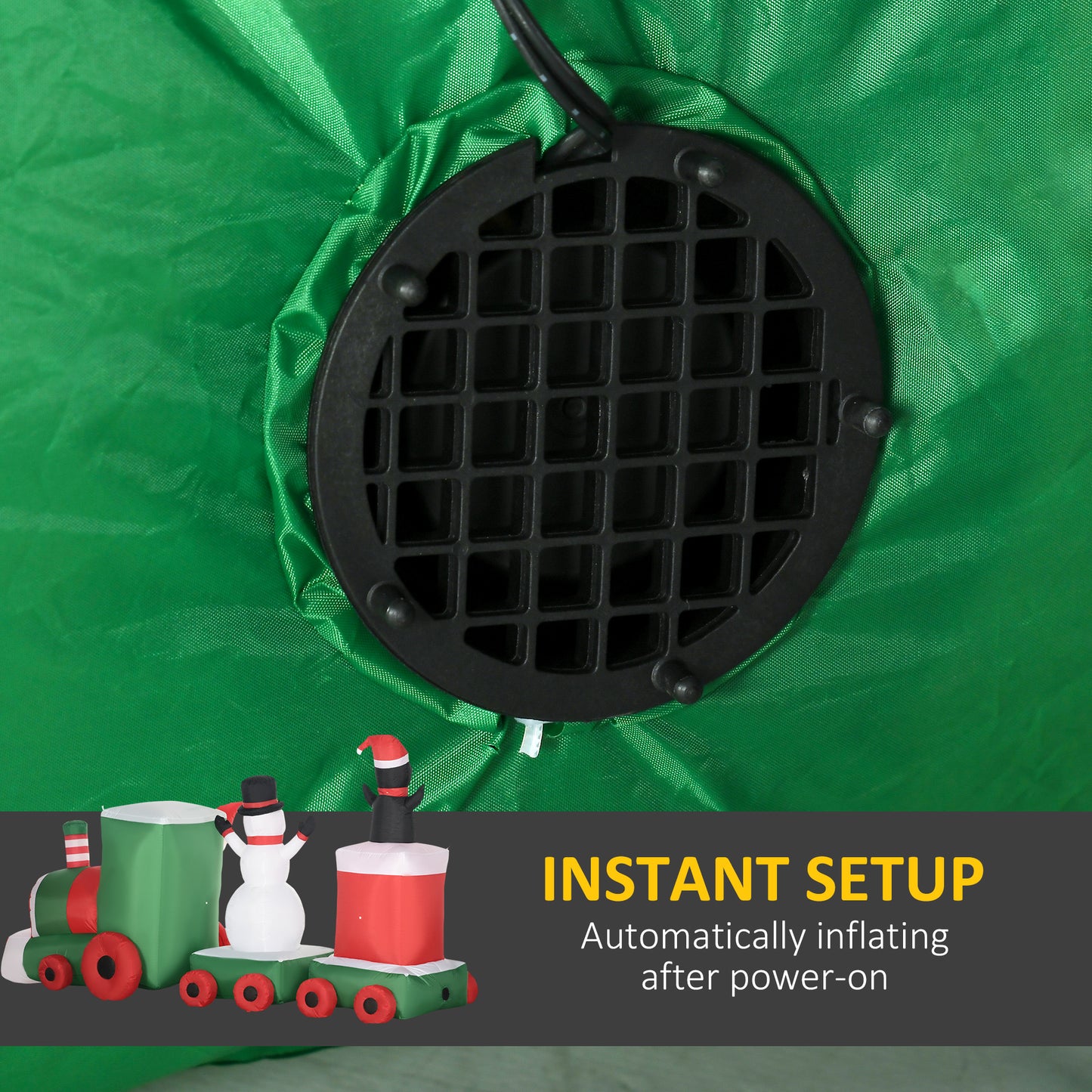 Green inflatable Christmas train with snowman and festive details featuring a builtin blower