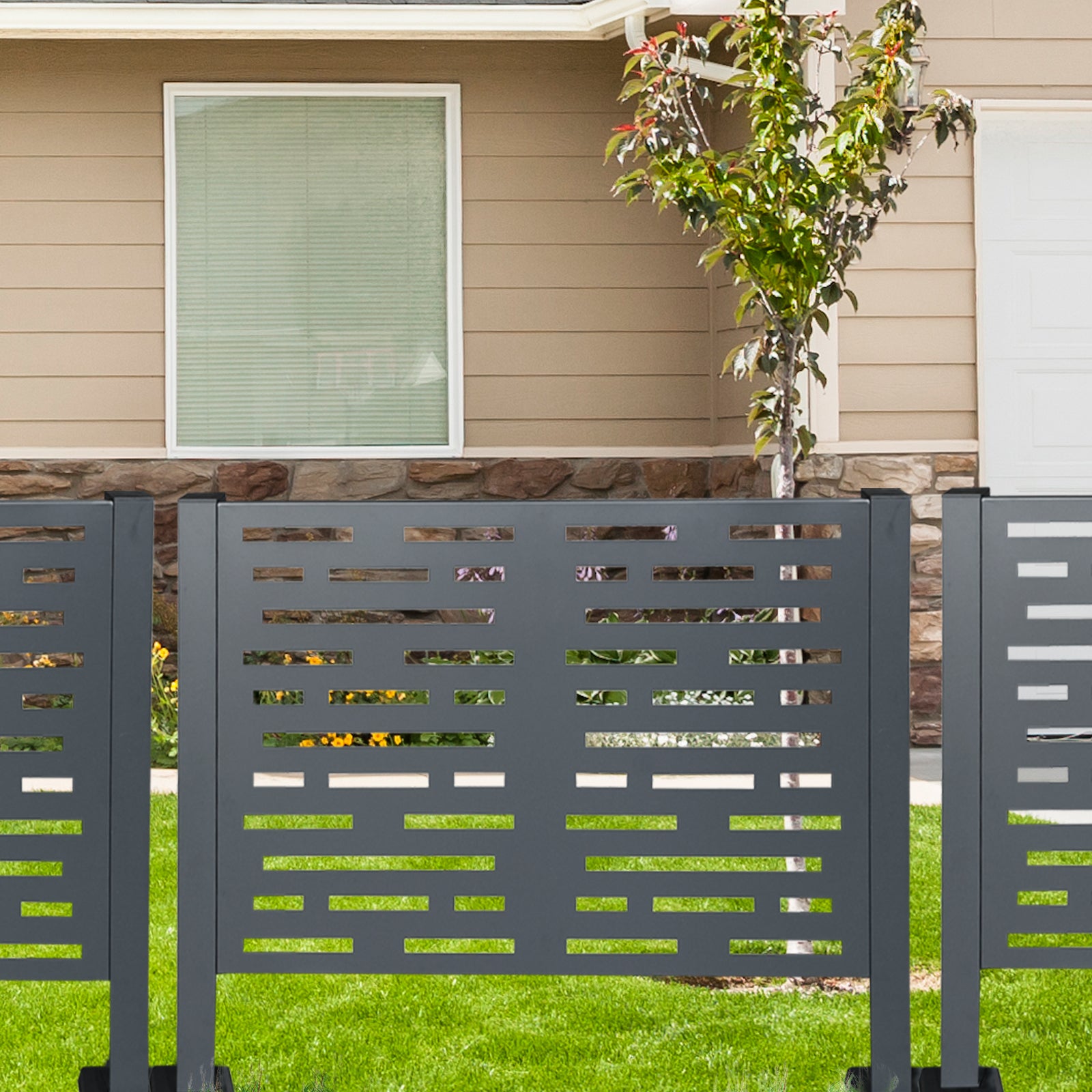 Modern charcoal grey metal garden screen with abstract cutouts ideal for privacy