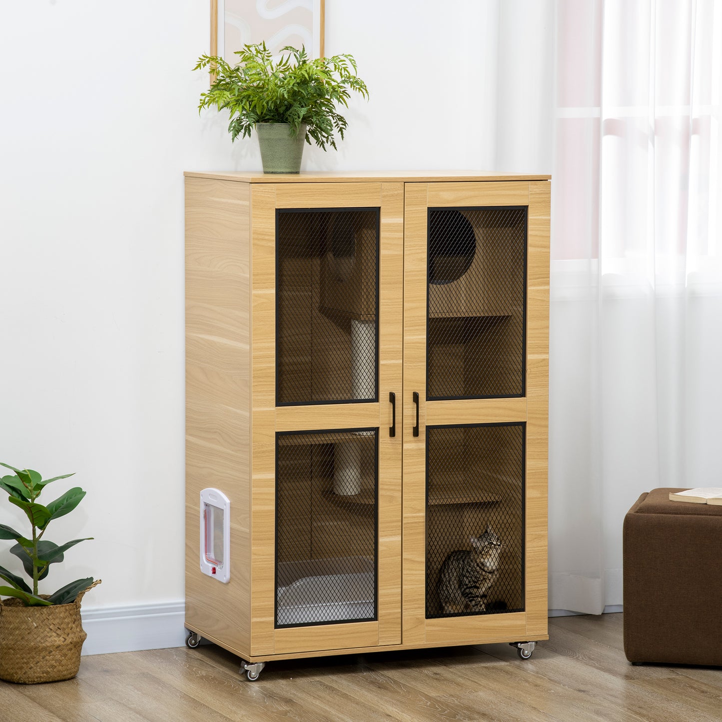 Light wood indoor cat enclosure with mesh doors and integrated litter box